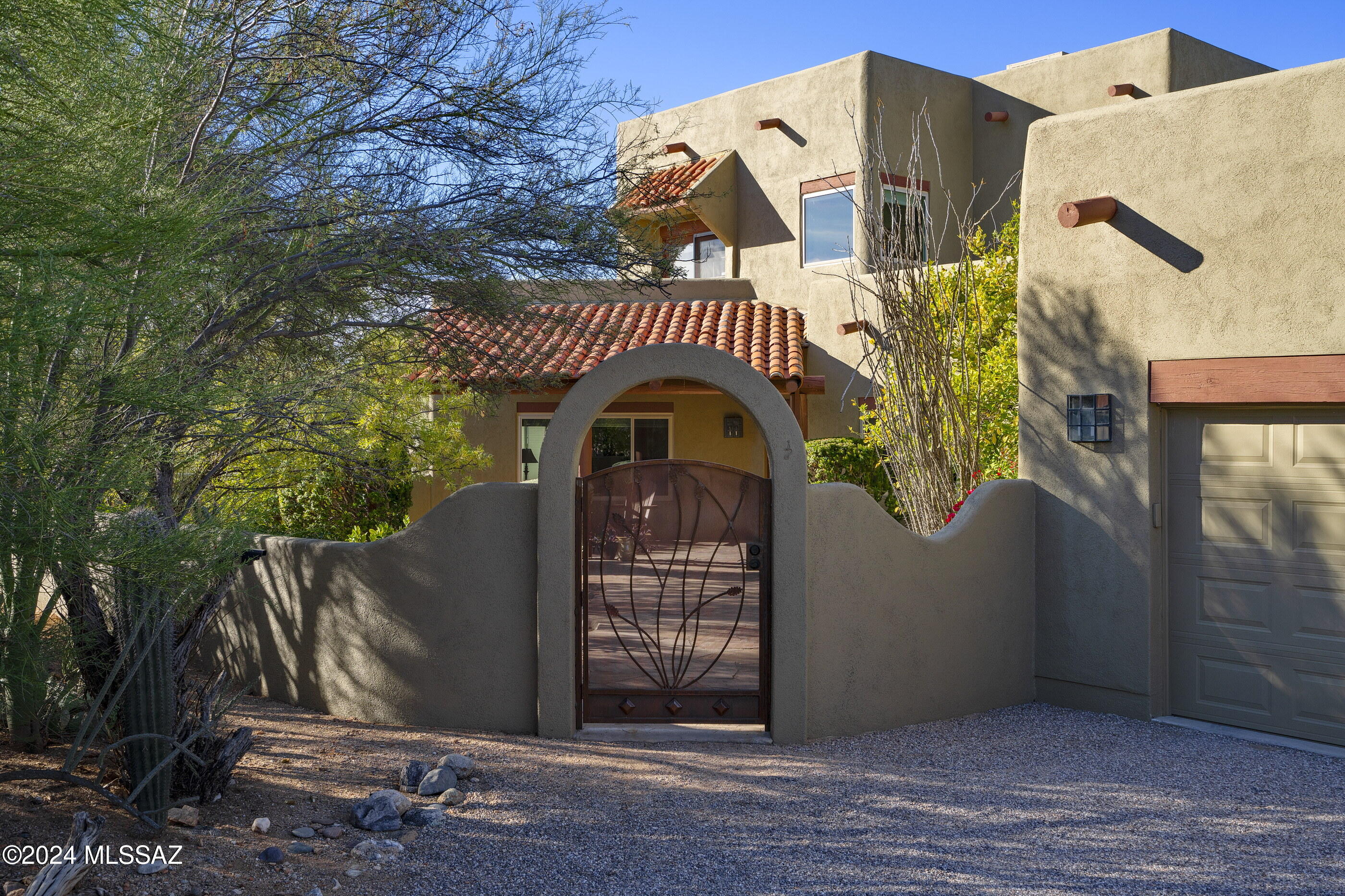 Shadow Hills Home set back on a private cul-de-sac lot w/ plenty of parking for your guest.  Welcoming large courtyard w/ citrus & mountain views. Entertainer's dream w/ entire 2nd floor being the extended family room w/ wood burning fireplace, built in bar/sink, two patios on each side to take in panoramic, city, mountain, pool & spa views. Main 1st floor are the living areas including 4 generous bedrooms, updated 2 1/2 baths, including primary bd w/ mtn views, modern bath wet area w/ tub and rain shower, 2 walk-in closets, living rm w/ additional fireplace, kitchen w/ 2 pantries & formal dining. Lots of updating, soft water unit installed 2024, all new vinyl windows 2023, upstairs heat pump 2022, outside repainted in 2020, updated pool equipment, oversized garage w/ EV power & storage.
