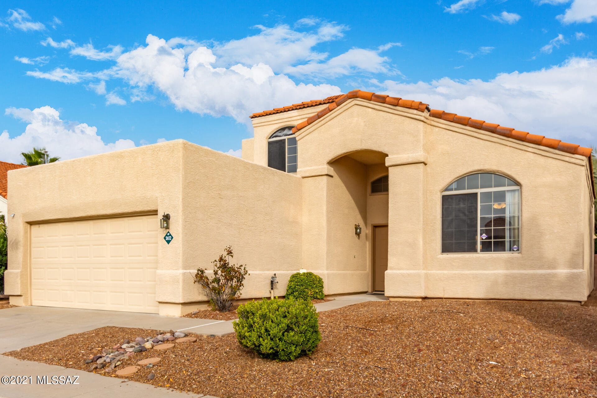 Gorgeous turn-key home in the desirable Linda Vista Estates is the one! This property has 2-car garage, easy-care landscape, and an exquisite view of the White Tank Mountains! Enter to discover the welcoming living/dining room with dramatic vaulted ceiling, soothing palette, and tile flooring throughout. The well-sized family room has a cozy fireplace excellent for chilly AZ nights! Cook your favorite meal in this fully-equipped kitchen offering ample white cabinets w/crown moulding, counter space for your cooking needs, and a peninsula w/breakfast bar. The large main bedroom showcases soft carpet, deluxe bathroom w/dual sinks, soaking tub, a walk-in closet, and balcony access where you can enjoy morning coffee. Gather your loved ones in this perfectly-sized backyard featuring covered patio and an expansive concrete patio ready for entertainment. Make this home yours now!