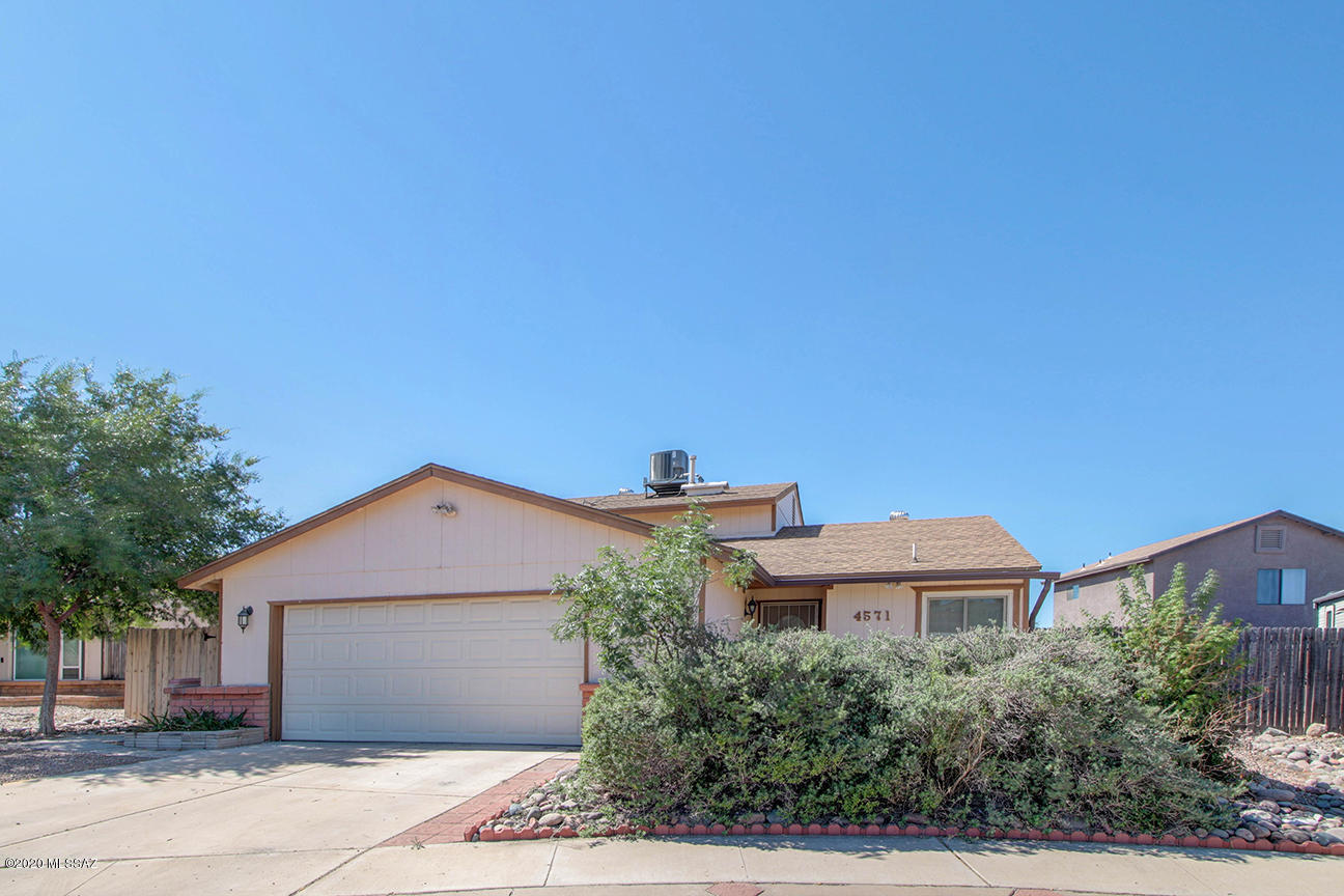Rare to find a tri-level in Tucson.  The downstairs has been converted to include 2 bedrooms.  Kitchen was updated in 2009.  Some Anderson Windows (western) facing. When washer and dryer were moved to garage, great extra storage was created, private space for a child with their computer! (School? )  Brand new stove/oven purchased for listing.
