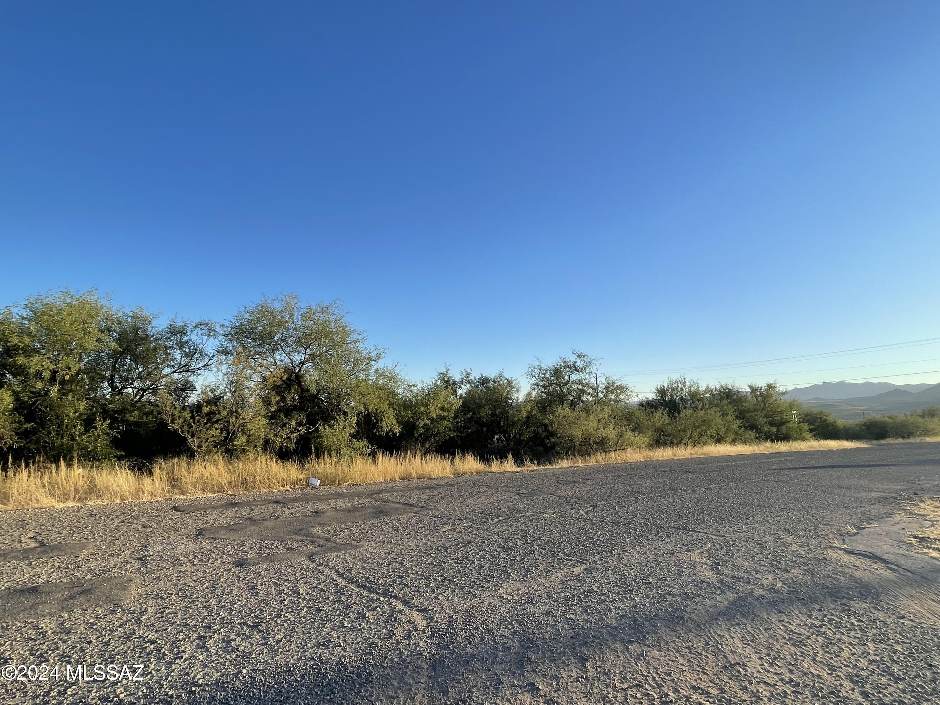 Build your home on this .24-acre lot with great views of the surrounding mountains. It is a corner lot on a paved road. Electricity poles and water are nearby. Just minutes away from shopping and restaurants. Easy access to the freeway.