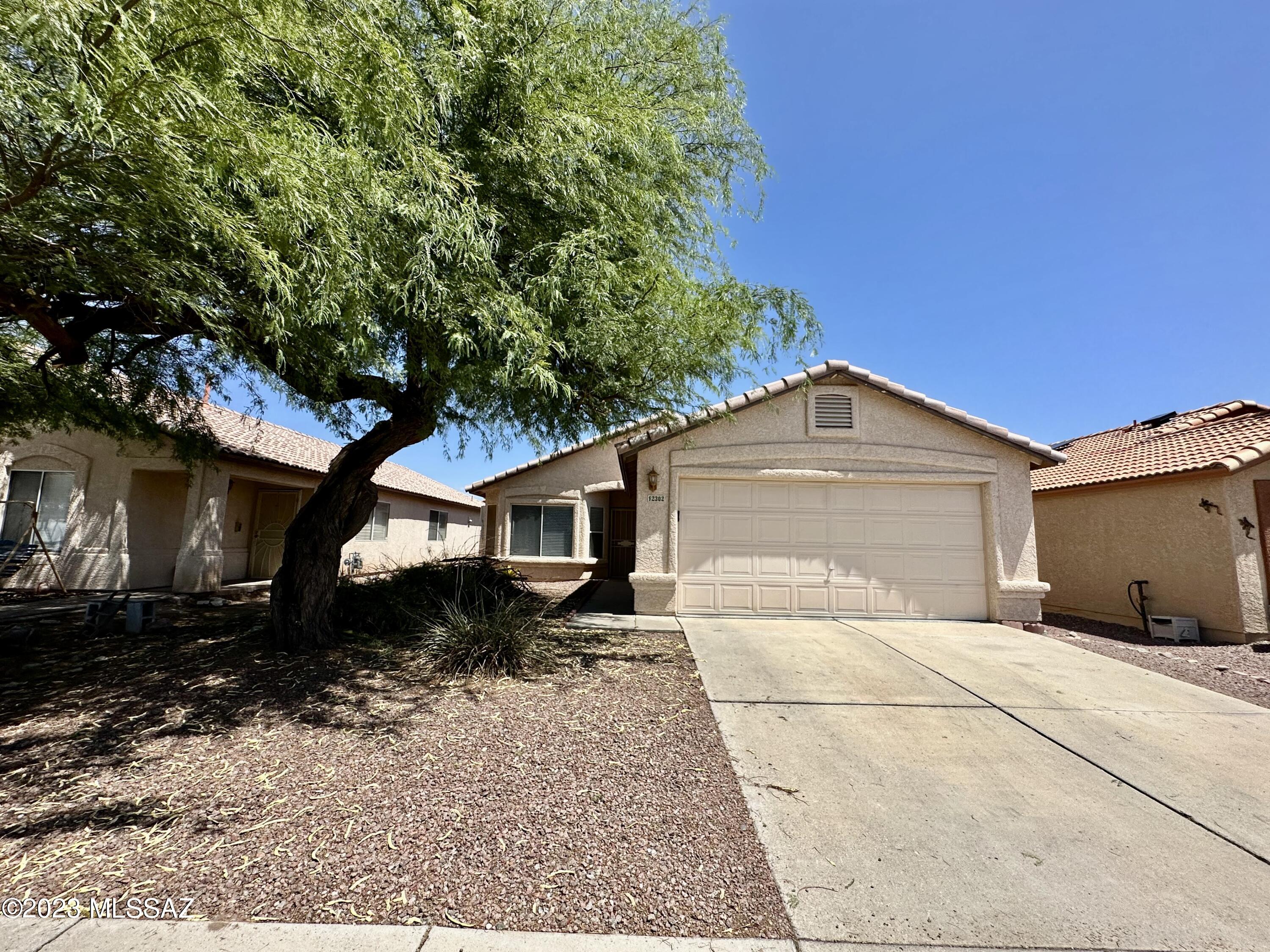 The house is north/south facing with a lot of windows and brings in beautiful morning and afternoon light. From the dining area, you can also see views of the Catalina mountains. It also features stained flooring throughout the home, Stainless steel appliances, a Washer and dryer, and decorative landscapes in the front and back yard. Convenient to downtown, shopping, and I-10. Blue Fox is an Equal Opportunity Housing Provider. We are also licensed Realtors