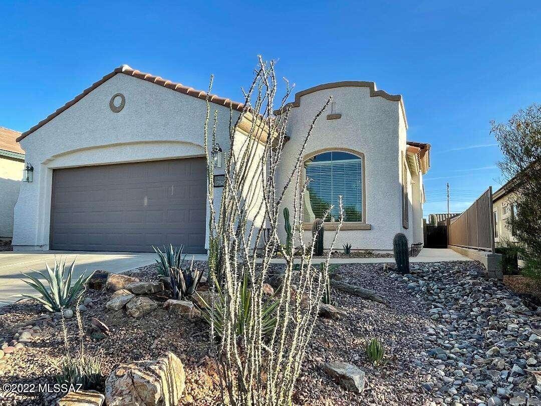 55+ community. Turnkey home including all furniture! Just bring your toothbrush! Perfect for snowbirds looking to get into this fabulous community. 3 bedroom 2 bathroom home with upgraded appliances, new AC, tile accents, new ceiling fans, soft water. Second bedroom has a Murphy bed currently used as a sewing room. Newer gas hot water heater. Low water use backyard on timed drip irrigation. Complete with your own saguaros! North south facing home. Security front door to let fresh air in while providing security. Only three homes in this private cul de sac which means you have your own private parking lot for guests. This home needs nothing. Horizontal blinds in all rooms. Includes garden shed with landscaping tools.