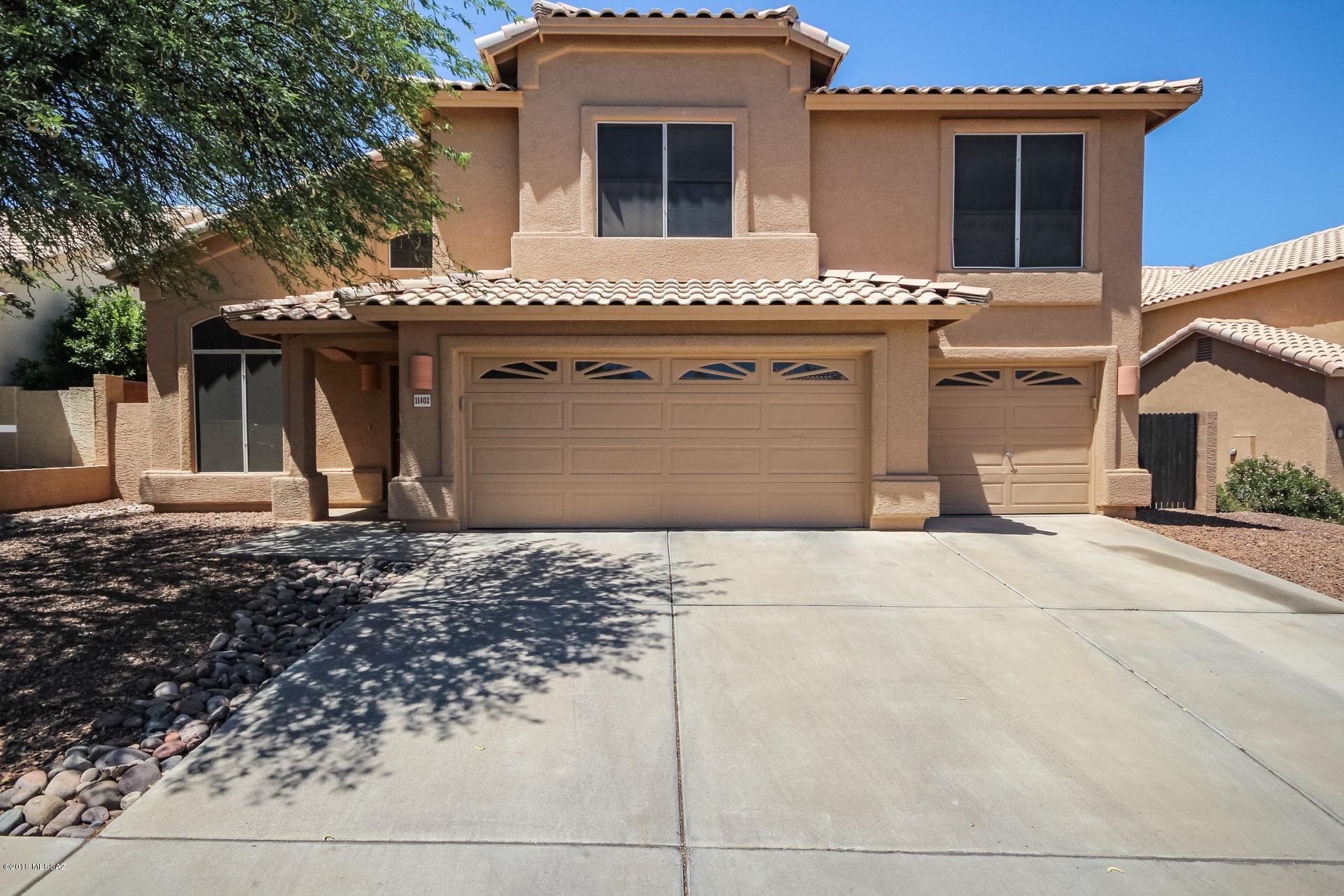 Look no further, this 4 bedroom / 2.5 bathroom home in the highly desirable Oro Valley subdivision of Copper Creek is ready for your immediate move in! The home features 18x18 tile & new carpet, soaring ceilings & neutral paint colors throughout. Over looking the family room, the kitchen features: stainless steel appliances, kitchen island and breakfast nook! The master retreat boasts a large walk in closet as well as an en-suite with dual vanities, separate shower & tub and private toilet room! The backyard is perfect for entertaining featuring covered patio, natural desert landscaping & grass as well as private pool & heated spa! This one will not last!