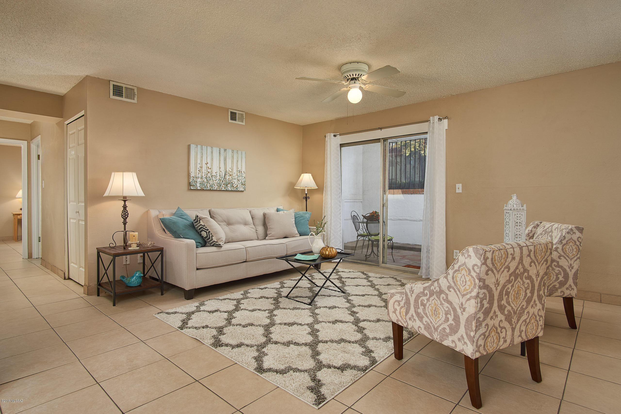 Tastefully remodeled unit featuring fresh paint and tile throughout NO carpet.  Master suite features huge  walk-in closet. This floor plan is one with shower in the master bath. HVAC. was replaced within the last two years. Great location close to shopping, restaurants, hospital, bus line, post office. Pool, picnic area, walking paths, swing set and clubhouse nearby. Assigned covered parking coveys with sale. Laundry in the building. HOA fees cover water, gas (hot water and furnace), trash, exterior and roof maintenance, landscaping, pest control, liability insurance.