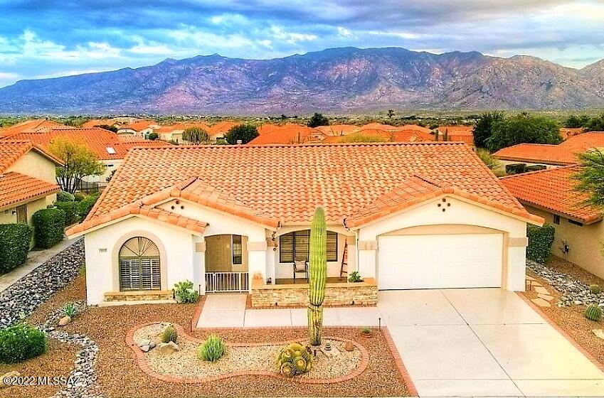 Sun City Spectacular - Remodeled Open Pacifica w/ Panoramic Mountain Views! This 1,750 sq. ft., 2 BR/2 BA + Bonus Room home is Bright & Cheerful Inside and Out. Enjoy the Open floorplan w/ Charming Gas Fireplace, Pretty Plantation Shutters, Owner's Suite w/ Separate Walk in Shower & Soaking Tub, Walk in Closet, BR 2 w/ Murphy Bed & Wonderfully Upgraded Eat-In Kitchen w/ Breakfast Bar, Stainless Appliances & Magnificent Catalina Mountain Views from your Kitchen, Family Room, Owner's Suite & Covered Back Patio. Enjoy your Back Yard Retreat full of Arizona's Colorful Splendor w/ Majestic Saguaros & Gorgeous Views! With the perfect combination of Beauty & Easy Living - this Home has it all! Sun City is a 45+ Active Adult Community w/ 18 Hole Golf Course, Fitness Ctr., 2 Pools, Clubs & More.
