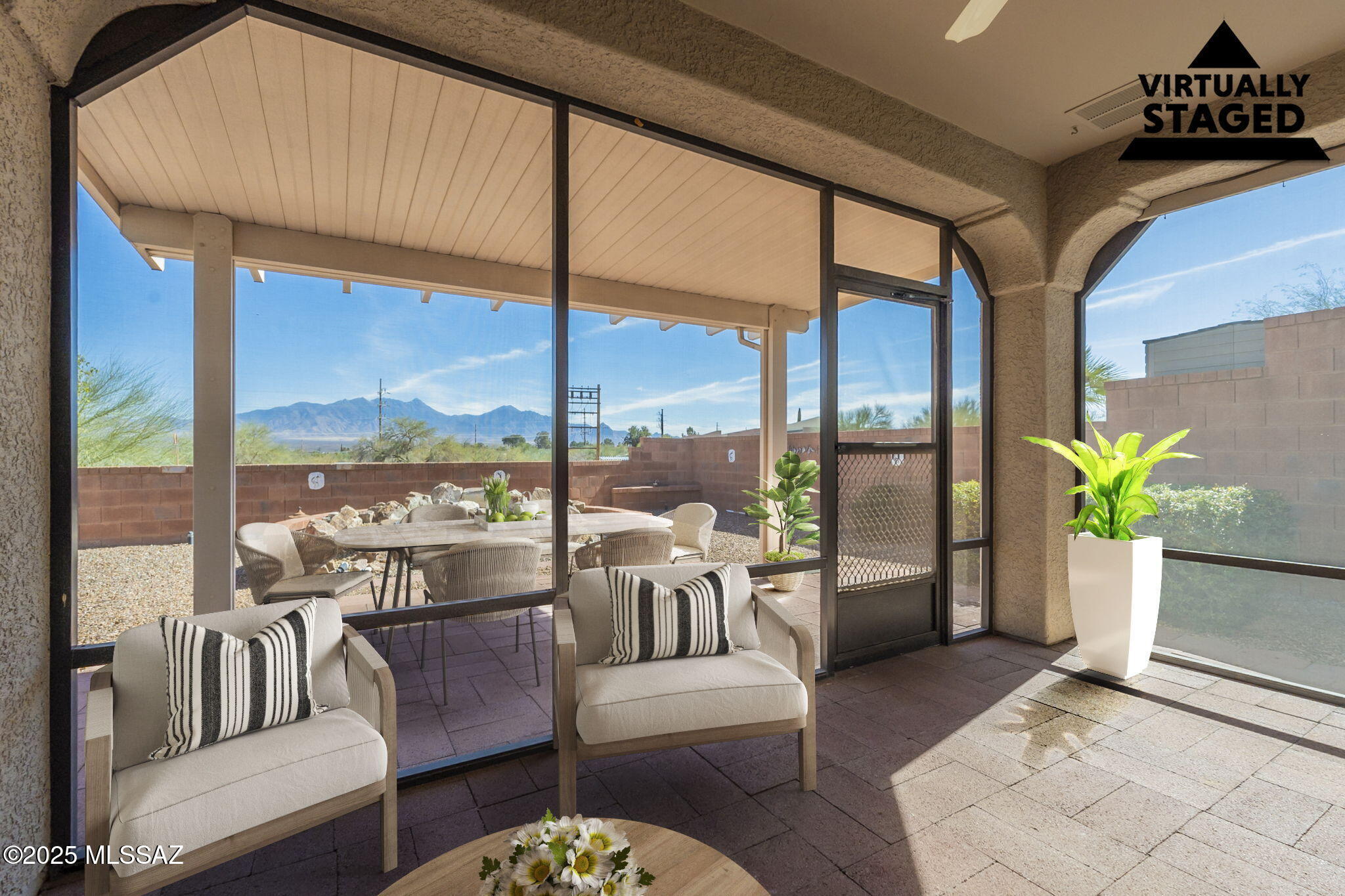 TWO Primary Suites, Panoramic Mountain VIEWS, split floorplan!!  Southwest living at its FINEST!  Block away to the popular Las Campanas GVR Center!!  No carpet throughout on this beauty!  The kitchen features 2 very spacious pantries, double oven, quartz countertops, hand painted decor backsplash, center island.  Enjoy your western style wet bar with saloon doors to entertain all your guests in your desert oasis! The garage is equipped with tons of storage and features a workshop as well!! Views do not get better than this, go into your Arizona Room and enjoy your view!