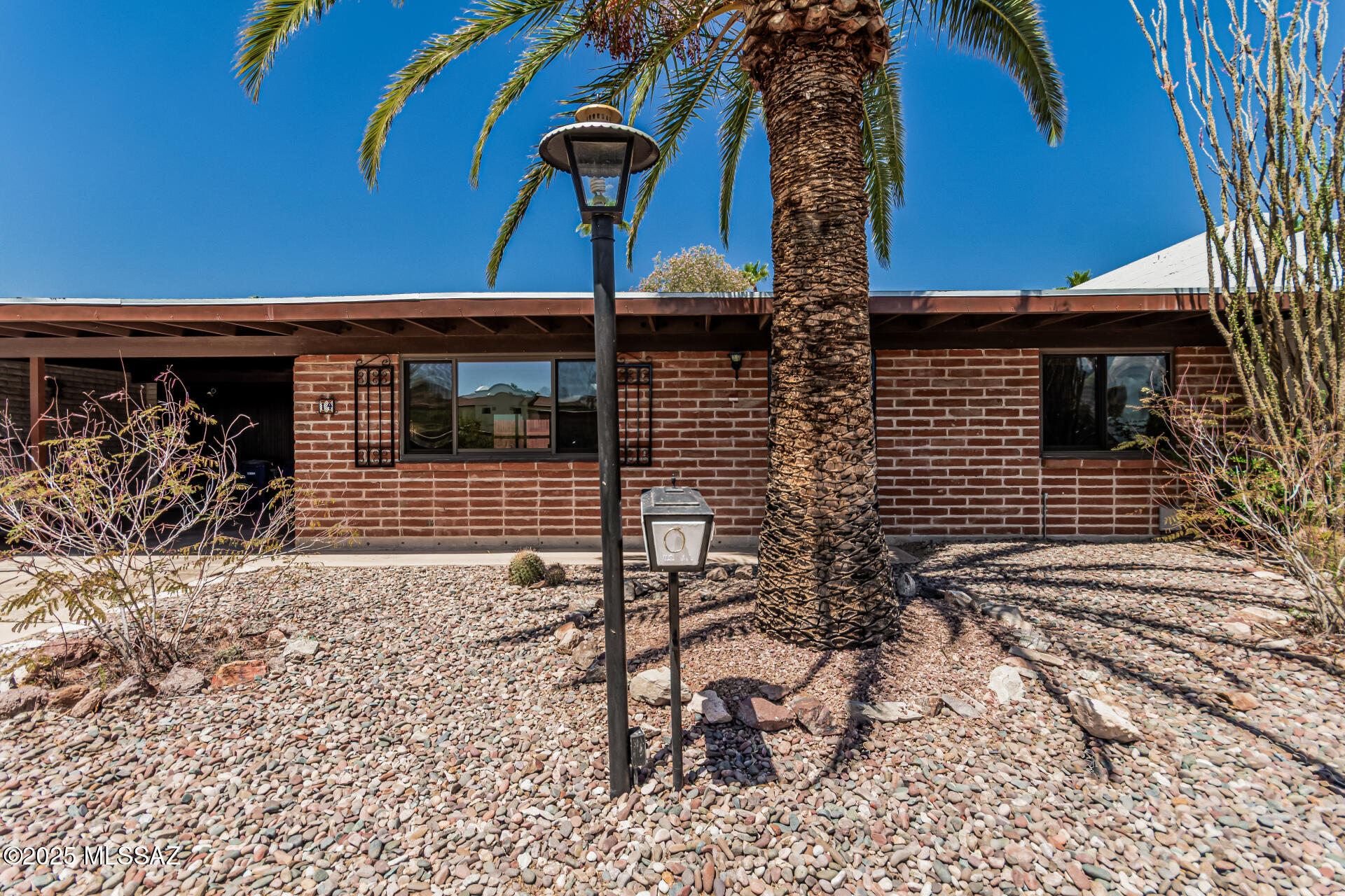 Nestled near the scenic Tucson Mountains, this beautifully updated single-level townhome is located in a vibrant 55+ community offering both comfort and convenience. Enjoy an open, light-filled floor plan featuring over $40,000 in recent upgrades, including a brand-new roof, updated electrical, new flooring, a reimagined open-concept kitchen and living area, modern appliances, a new skylight, and more. Step outside to a tranquil and private backyard—perfect for relaxing or entertaining. Community amenities include a sparkling pool, clubhouse, exercise room, and included water and trash services. This lovely home is move-in ready and ideal for those seeking a peaceful, active lifestyle. Dogs are not allowed (except service animal) and only 1 indoor cat permitted.