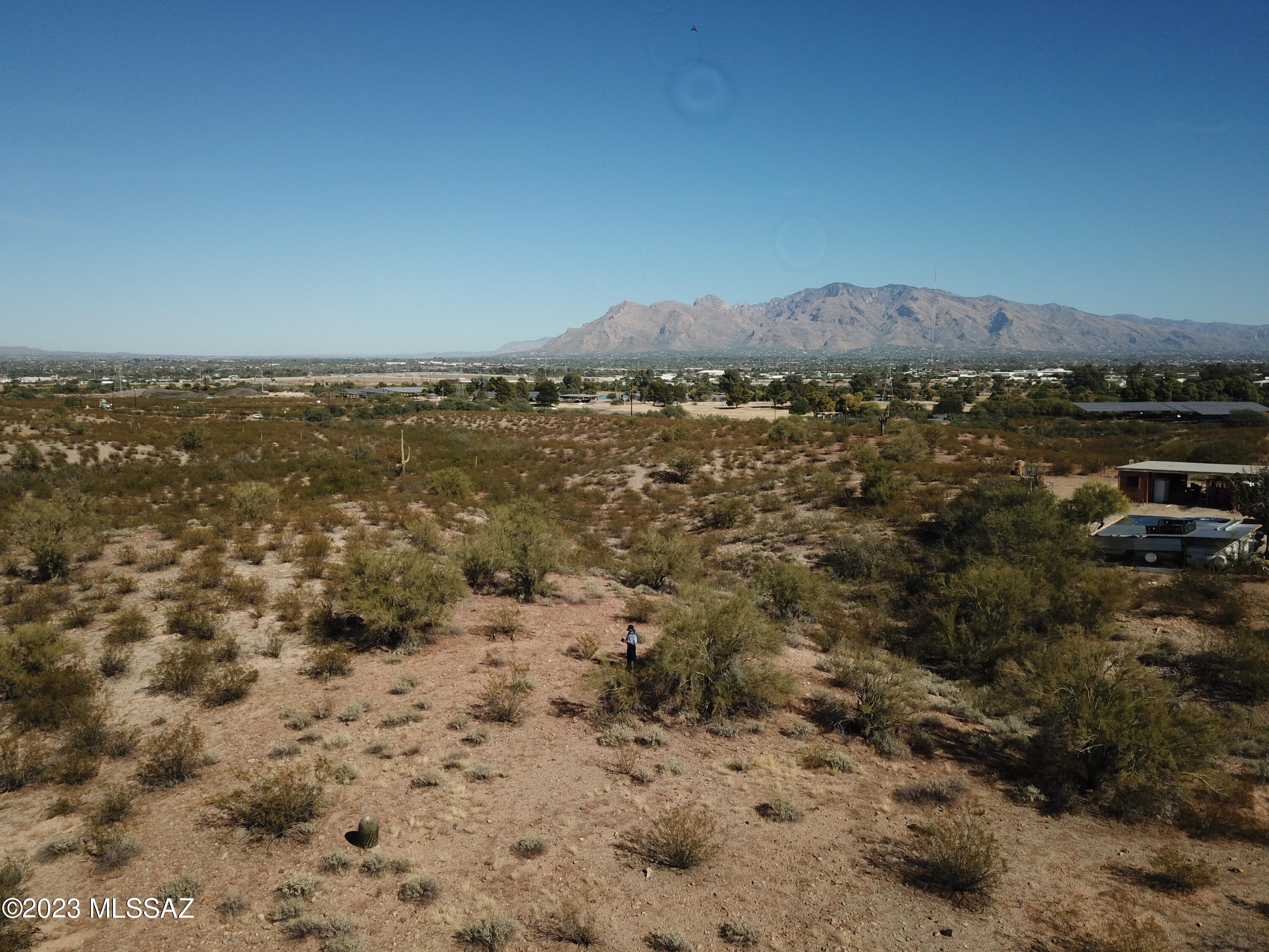 Wonderful close in Suburban Ranch homesite with great views of city lights and mountains. Easy build, easy access to downtown, I-10 and major shopping. No HOA, no CCR's, abundant natural vegetation. Area of custom homes. Horses allowed. City of Tucson Water 1'' meter installed on north property line is a big advantage. See additional documents for location of availability on Sweetwater Road of sewer, water, gas, electric and phone plus sleeve under road for future utility.