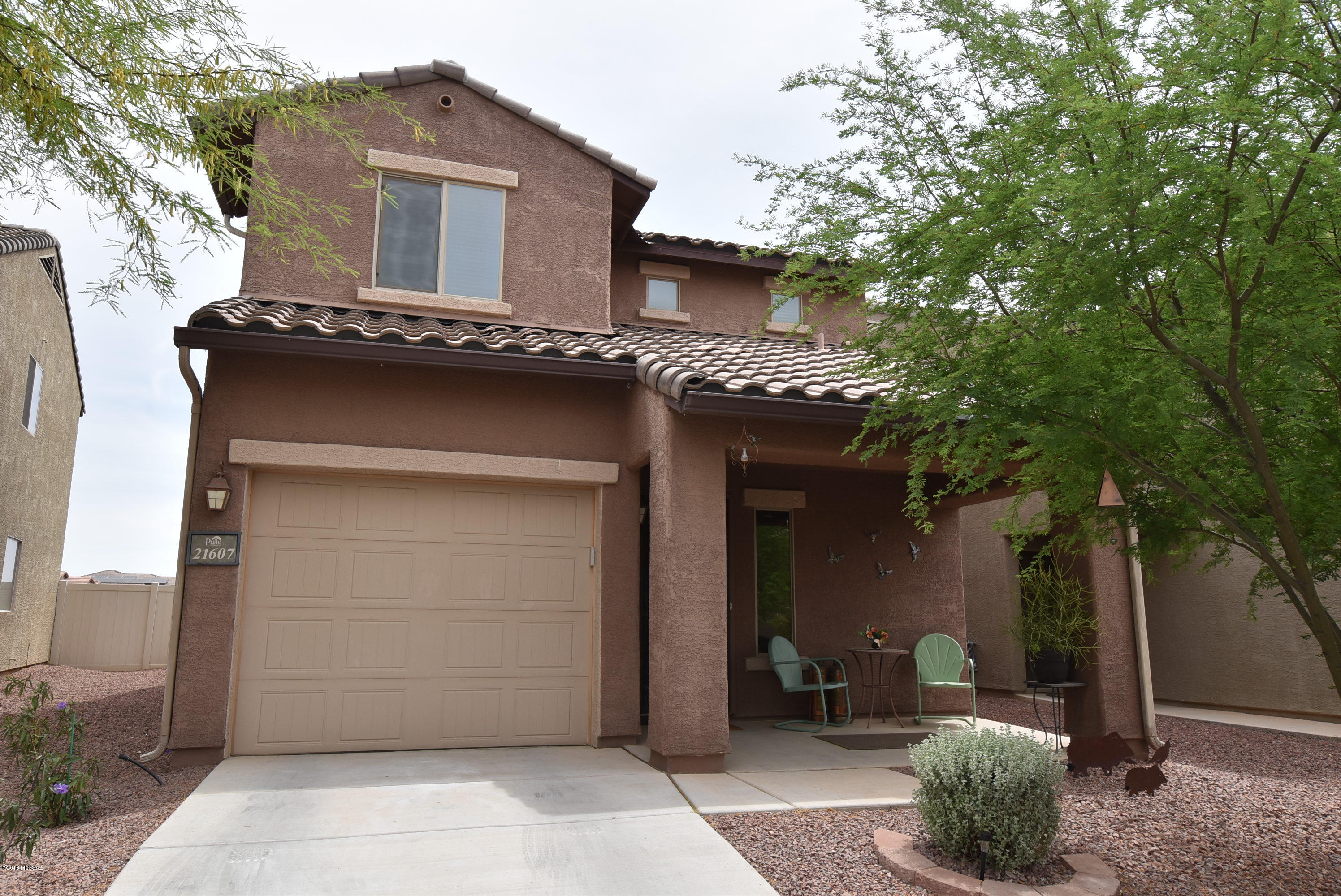 Charming & nicely upgraded home in beautiful Red Rock Village. All tile downstairs with tile in laundry & 2 baths upstairs. Kitchen includes butcher block counter tops,tile back splash stainless appliances. Refrigerator,washer & dryer included!  Covered patio & large fenced yard with turf. 2 car tandem garage (back part of garage has potential to be modified to be a third bedroom).
USDA/100% financing eligible. 
Red Rock K-8 school in the neighborhood. Community offers the finest amenities for family fun-pools including lap pool,waterslides & splash zone,beach volleyball, basketball courts,skate park,2 baseball fields,walking paths,parks including a dog park,grassy areas & various playgrounds. Sun Run Solar lease can be easily assumed by buyers.