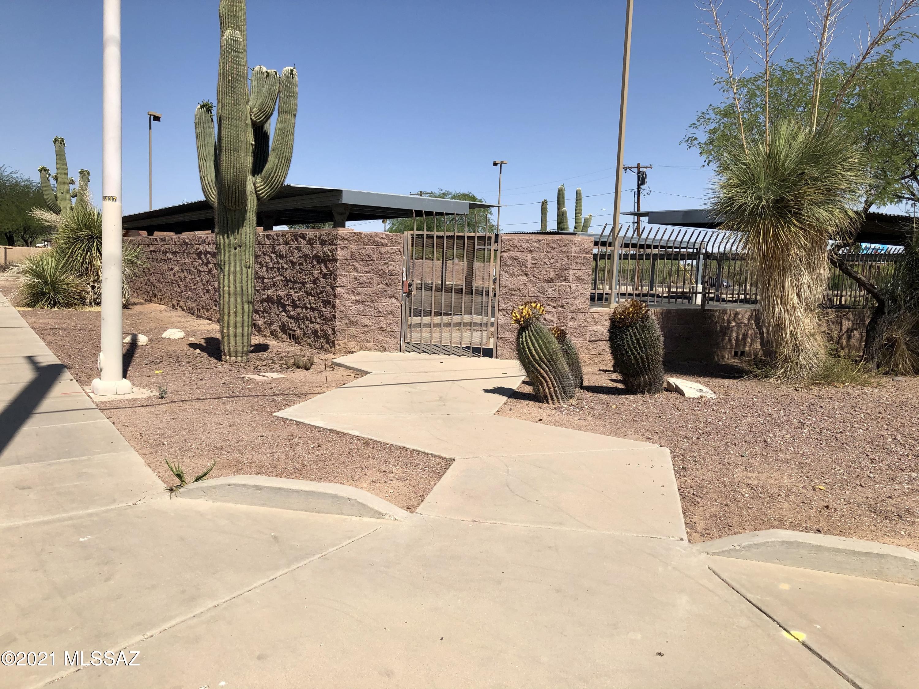 Commercial parking, southeast corner of Tucson Blvd & 23rd St, just over 20,000 square foot, 125 front foot on Tucson Blvd,  zoned C-1, with walled/fenced lot, security lighting, remote controlled gated entry, 29 covered parking spaces, and 8 uncovered, outside of the fencing is landscaped, lots to the north on 22nd St are city owned, lots of potential uses