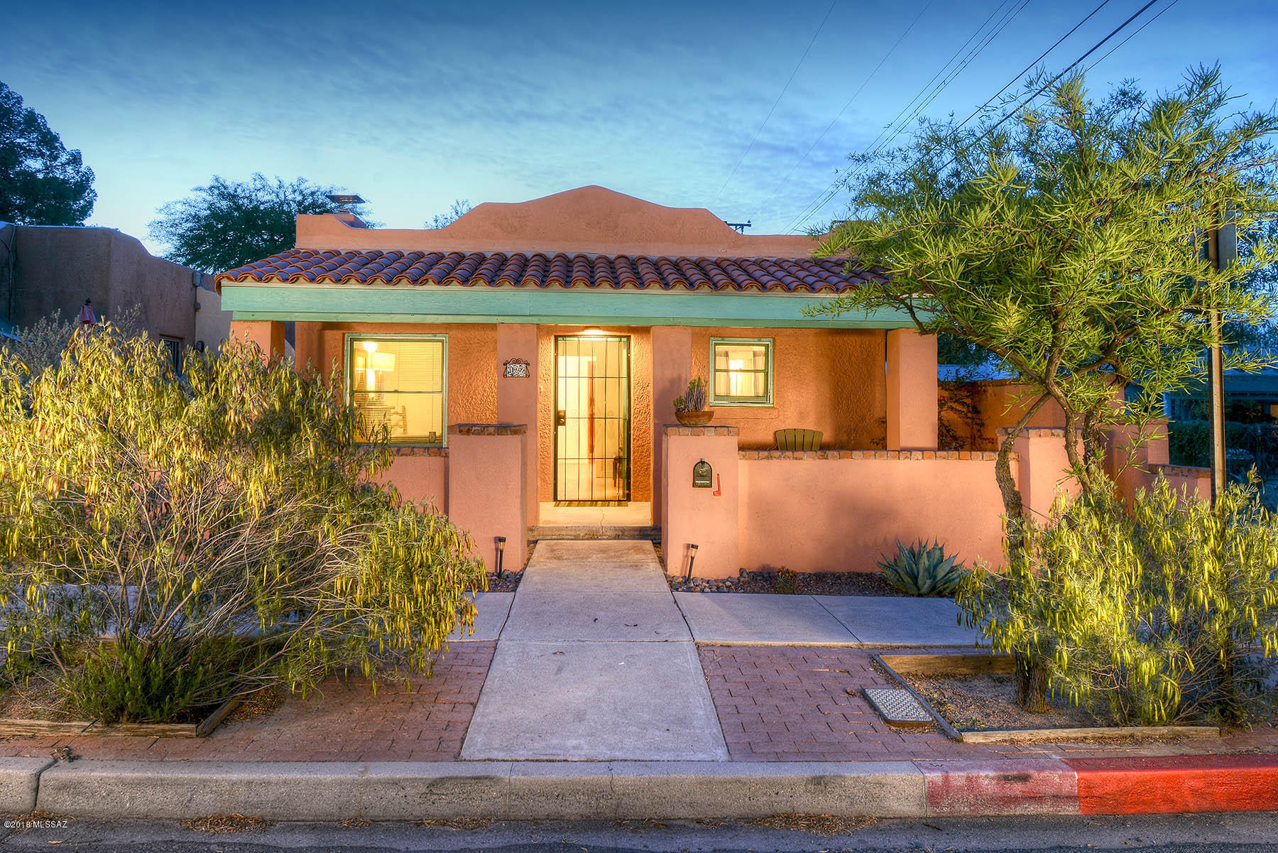 Beautiful Sam Hughes home in the heart of the neighborhood. Quaint front porch & courtyard entryway.  Home offers hardwood floors, well appointed kitchen, formal dining room. 2 bedrooms in the main house. Master has private bathroom and access to walled and private backyard canopied by large Mesquite trees.  Separate Studio guest house has rented for $575 per month and has a separate entrance and private yard.  Walking distance to the U of A, Modern Street car, Himmel Park and the Rincon market!