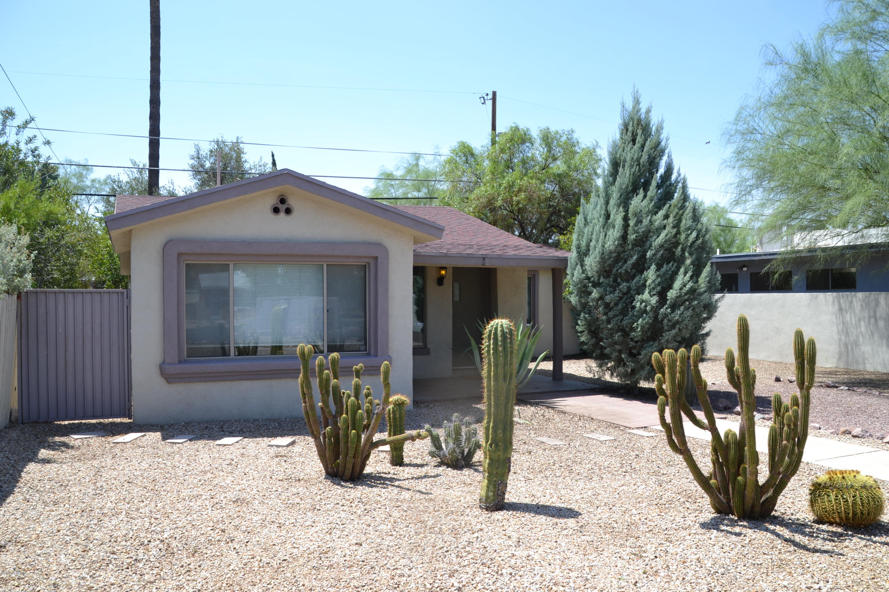 This is your opportunity to live in the Blenman-Elm Historic District! This gorgeous home has lots of designer touches throughout. Large master suite with dual stand up showers, jack & jill vanities/sinks and large walk in closet. Custom paint and details throughout, upgraded fixtures, kitchen cabinets and counters. Centrally located, close to U of A, restaurants and shops. This is a huge lot with plenty of room to build a guest house or another unit. Don't miss this rare opportunity.