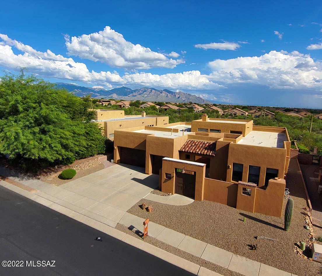 VIEWS, VIEWS, VIEWS ! Fabulous find in gated Preserve in Dove Mountain! This 2655 sq ft home offers 3 BRs /2 BA in  main home & separate casita w/BA!  Spacious, gated courtyard w/ beehive gas FP gives you a private space to unwind on a chilly evening. Foyer opens to large great room, dining & kitchen! Clerestory windows make this home light & bright! Gas FP accented w/ stacked slate tile. Laundry w/ sink & storage is a few steps away. Secluded primary suite w/ soaking tub, walk in shower, spacious closet. Split plan bedrooms share hall BA w/ dual sinks. Casita entrance is off courtyard. Large covered patio is a welcome spot for al fresco dining & enjoying mountain views! Artificial turf brings a spot of color! 3 car garage w/ AC & storage. Call for private showing !