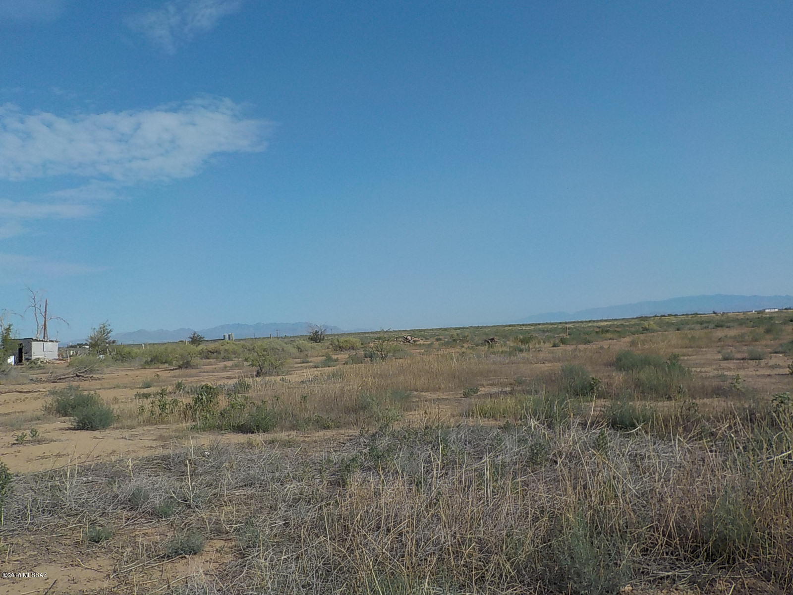 This property has a lot to offer, not only is there paved road access it is in a great farming location.  You can build your dream home, start a business, farm the possibilities are endless.  There is electric on the lot line and a capped well.  Beautiful mountain views and not far from Benson or Willcox.  Call listing agent today to view the property or drive by.