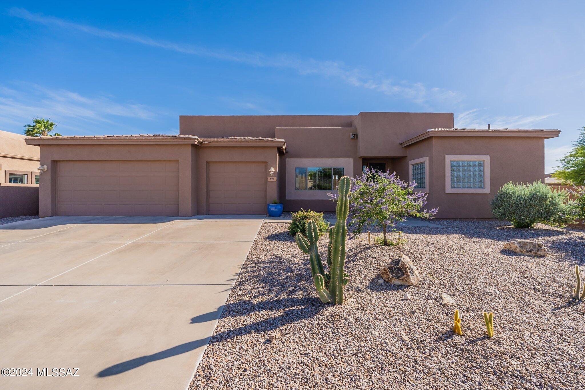 Stunning 4 bedroom/3bath/3 car garage (2734sqft) Contemporary home. One level split bedroom plan with a 4th bedroom perfect for guest suite or office. Dramatic entrance with high ceilings and striking large windows leads you into spacious living and dining areas. Kitchen is a chefs delight with ample cabinets, granite counters, 2 ovens, stainless appliances, built-in desk, eat-in bar & updated lighting. The cozy kitchen nook has a curved wall of windows and is a great spot to enjoy breakfast or coffee. Owner's suite with walk-in closet, soaking tub, double sinks & French door to backyard. Large backyard with a covered curved patio has room for a pool. On a cul-de-sac lot with mountain views, this home is not to be missed!  Walking distance to Innovation Academy and parks. Virtually Staged