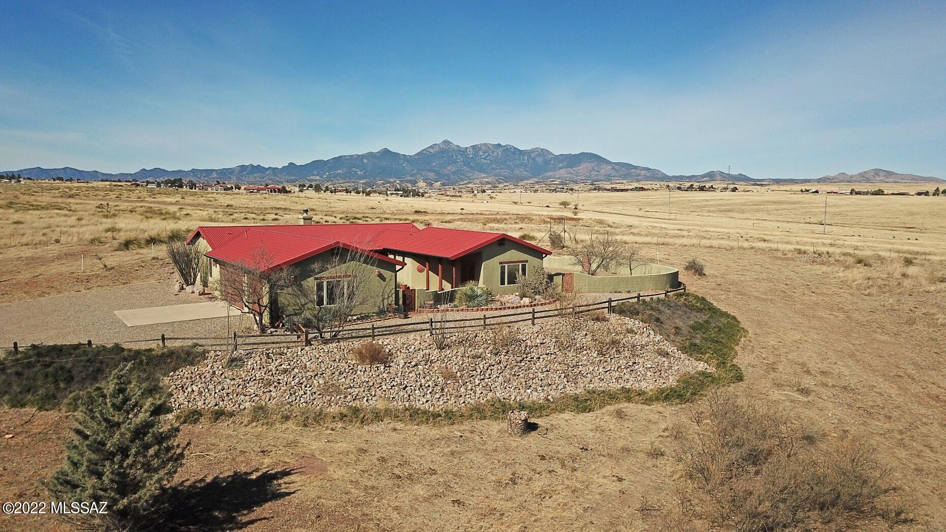 With Location, Views, Quality Build, and In Excellent Condition, this hilltop setting has it all.  In one of Sonoita's most desirable residential locations, convenient yet private, this lovingly maintained 2 owner home has 3 bedrooms, 2 1/2 baths, a library, large living room and dining area, 2 courtyards, and a 3 car garage with built in storage casework.  There is a high quality metal roof with matching flashings, recent interior repaint, numerous thoughtful SW design details, powder coated gates & security doors, Pella windows, a strong private well, tasteful landscaping, full fencing and ample room for additional outbuildings.  All appliances, including the new SS refrigerator, microwave and range, are included, as well as all furnishings.  This one is exceptional.
