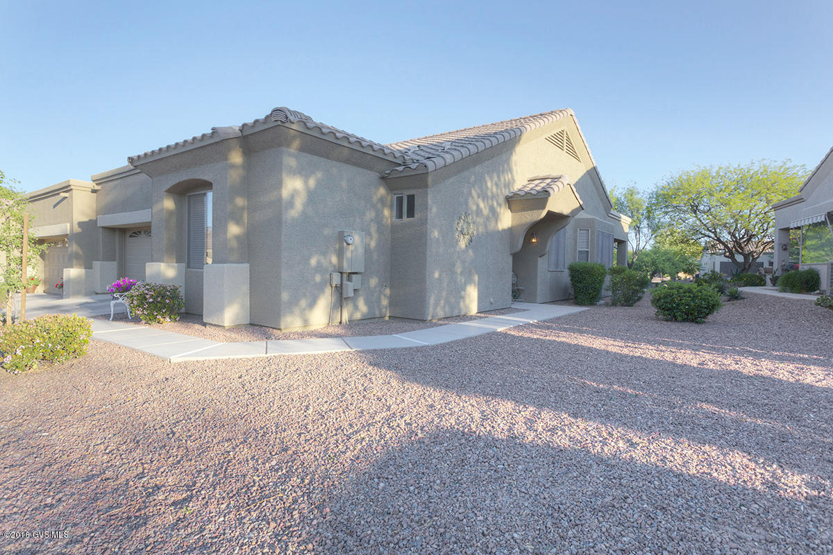This beautiful town home (TH) situated on a prime green belt lot has many of the popular upgrades and options buyers want. This most popular TH floor plan features a great room design with nice sized split bedrooms and a spacious interior den. The over-sized kitchen boasts raised panel maple cabinetry w/ crown molding and plenty of counter space.The great room sports a high vaulted ceiling w/ plant shelves, bay window and leads out to the wonderful patio and green belt beyond. Also dine in the perfect area surrounded by windows that also capture the manicured surroundings. Master Bedroom also has a bay window, spacious walk in closet, double sink executive height vanity an EZ care cultured marble shower. Your guests will love their private guest wing. The full patio completes ...  the total indoor outdoor package with this beautiful park like environment that you and your guests will enjoy. The two car garage has plenty of cabinet storage and a soft water loop. |\n|The one of a kind HOA is set up much like a condo, but w/ fee simple title. They maintain your landscaping, stucco, paint and roof. Also the water for your landscaping; monthly pest control; expanded basic cable TV; weekly trash and recyclable pickup; fire, hazard and liability insurance; common areas, gates and road upkeep; and they also maintain a healthy reserve fund.