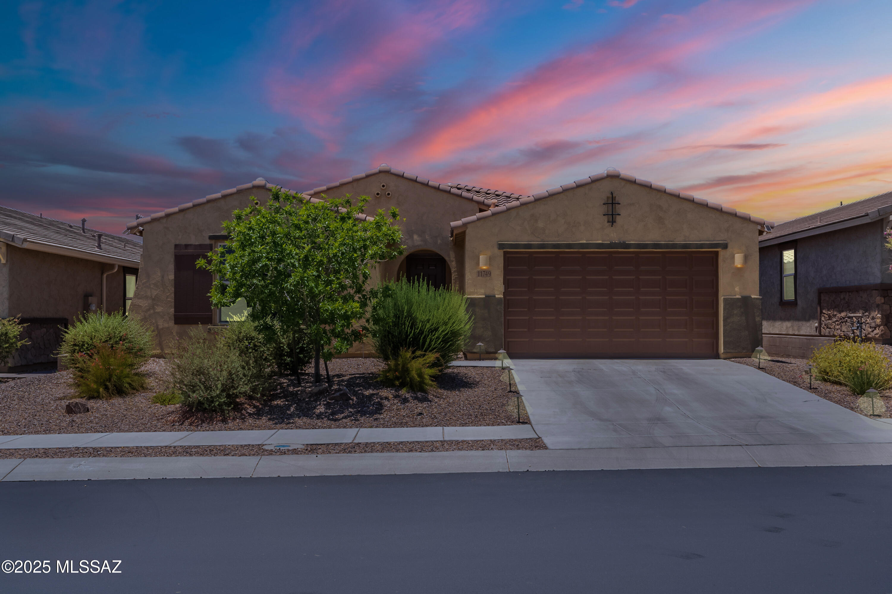 Welcome to your dream home in the prestigious gated Villages at Silverhawke, a premier enclave nestled in the heart of Oro Valley. This home offers a perfect blend of modern luxury and energy-efficient living. This stunning 3-bedroom home, built in 2019, is priced exceptionally BELOW market value, offering an incredible chance to own a piece of paradise in Oro Valley. Step inside to discover a wealth of upgrades and modern amenities. The gourmet kitchen is a chef's delight, featuring dual ovens, a designer backsplash, and a generous granite island that seamlessly overlooks the expansive great room and dining, perfect for entertaining. The private owner's suite is a serene spa like retreat, thoughtfully designed w/dual sinks, a super shower w/custom tile, double shower heads, and a spacious walk-in closet. Plush berber carpet and electric blinds throughout. This home is equipped with a fully OWNED $28,000 solar system, ensuring energy efficiency and significant savings on energy bills. Enjoy outdoor living at its finest with an upgraded full-width rear patio, a hot tub for relaxation, patio furniture included, and a built-in BBQ for alfresco dining. The 3-car tandem garage provides ample space for vehicles and storage. Villages at Silverhawke offers a premier lifestyle with a gated entrance and four parks. Don't miss this rare opportunity to own a beautifully upgraded home in one of Oro Valley's most sought-after communities. Schedule your private tour today and experience the exceptional value and luxury this home has to offer.