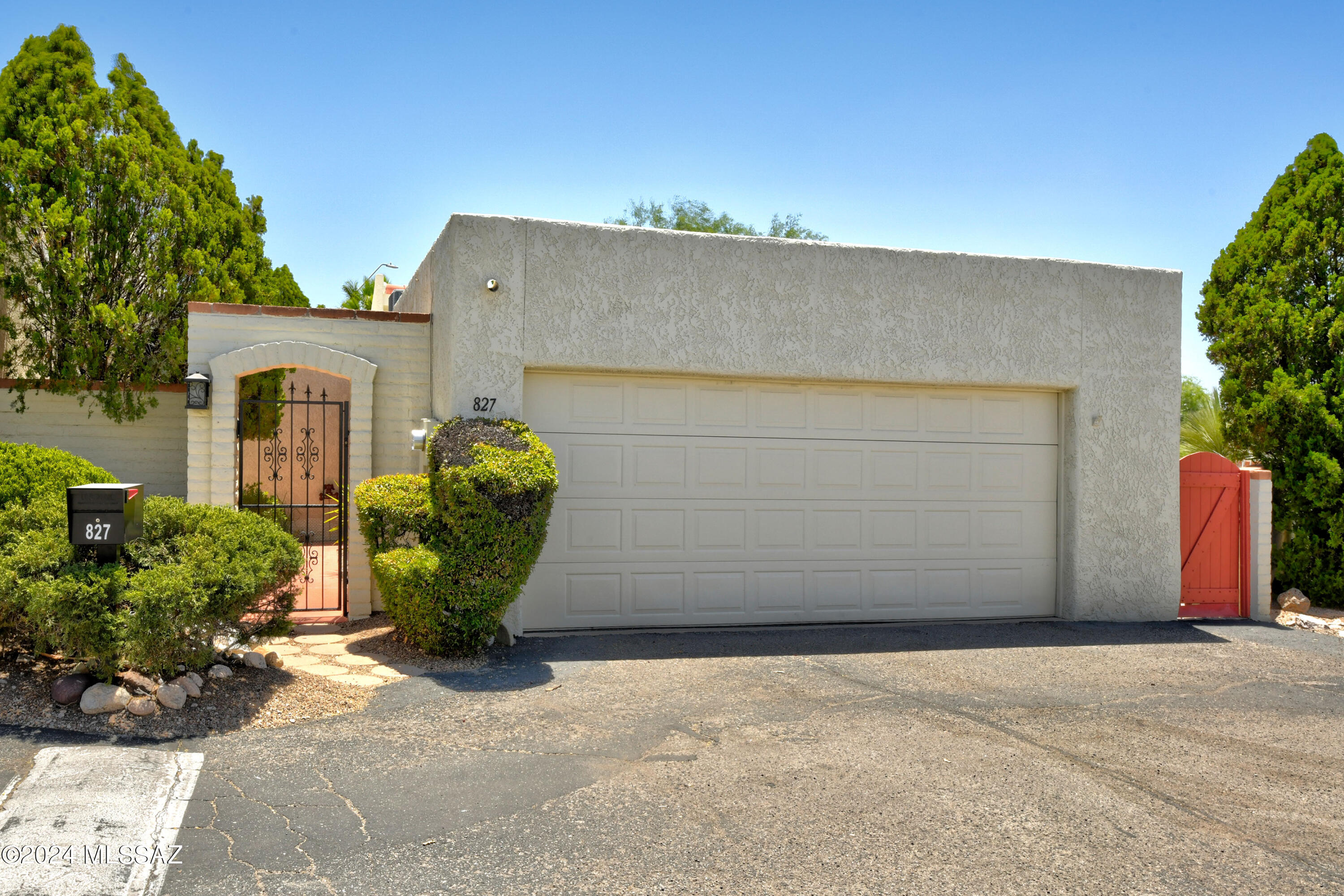 As you step inside through the lovely landscaped gated courtyard entry, you'll be greeted by high ceilings and tons of natural light thanks to clearstory windows and skylights.  The spacious living room features a cozy corner fireplace.    Adjacent to the living area you'll find a quaint dining area and a generous  eat-in kitchen with stainless steel appliances.   Generous primary suite is complete with a walk-in closet and updated bathroom. 2 additional bedrooms and full guest bath round out this special townhouse.    Charming backyard with  covered patio and extended pavers.    Terrific community pool area.    Great east side neighborhood moments away from shopping and dining  makes this home as convenient as it is beautiful.