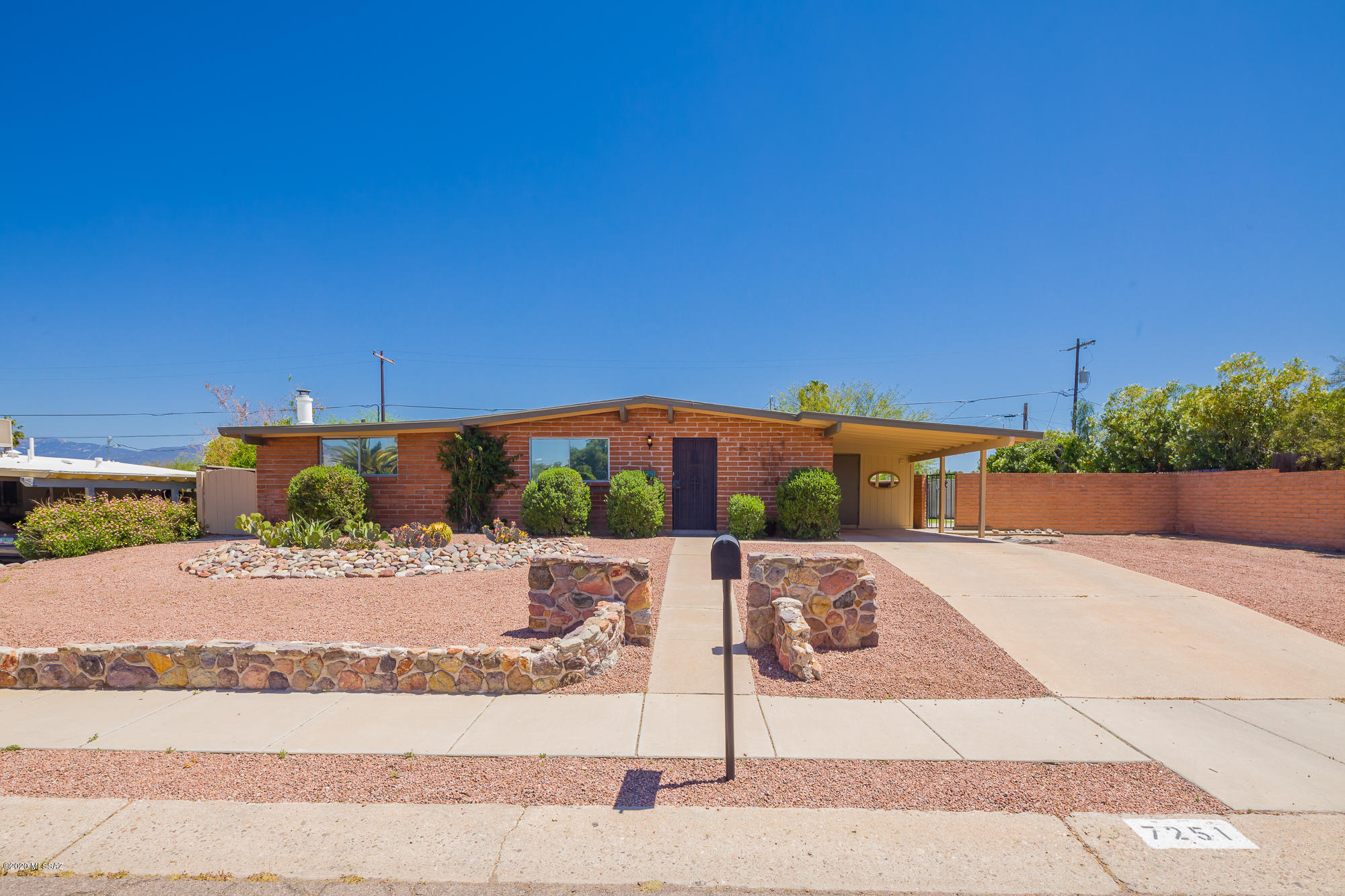 Lovely East side Mid Century Modern. Fantastic 
Curb appeal.  Close to schools and shopping. Angled Ceiling and natural wood beams give this home a warm and inviting feel.  Great views from Pool or front yard of Mountains.  Sunrises are great too.  New LVP porcelain tile in all traffic areas. New Exterior Paint. New Facia. New Dishwasher. 4 New ceiling fans. New skylight. All new faucets in baths and kitchen.  Huge Kitchen and Family room.  Wood burning fireplace. Gated Pool with two patios. Large Artificial grass completes the space. Plenty room front for garage or toys or RV.