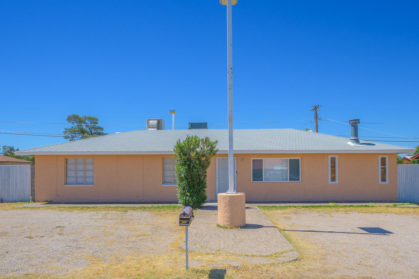 Come move right into this spacious 4bed/2ba on a large corner lot with easy access to dining, shopping, U of A and more! This home has central AC and evap cooler, fireplace in one bedroom,tile throughout with saltillo tile in bedroom/den with fireplace and 2 skylights. Dual pane windows installed in living and family rooms.  The spacious yard has 3 double gated access points with room RVs and toys and another gated yard within for gardening, pets etc.., and as an added bonus, a separate storage building.!! This priced to sell and ready to go!!