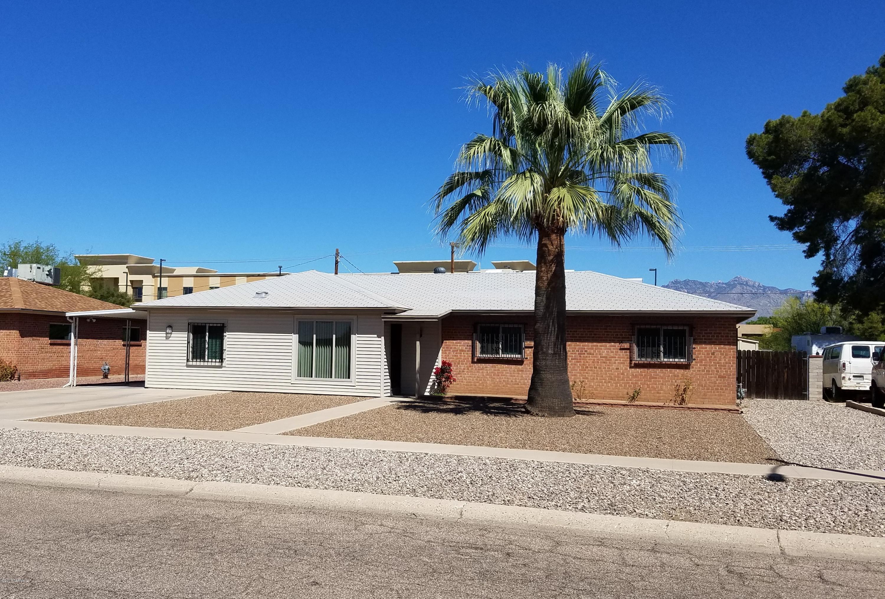 **BRAND NEW ROOF TO BE INSTALLED AND COMPLETED BY CLOSE OF ESCROW WITH ACCEPTED OFFER!** Must see this...Brick home that is move in ready. This well cared for 4 bedroom 2 bath home is  near schools, entertainment, public transport, shopping and more! Near Palo Verde park which has a POOL, dog park, and lots of recreation space! This lovely home has updated dual pane windows. The 4th bedroom is located on the opposite side of the home so it makes a great office/playroom/music room or a 4th bedroom! The Kitchen had a complete remodel a few years ago. The dishwasher is brand new the rest of the appliances are newer. Enjoy your morning coffee at the breakfast bar. The home has a great North/South facing orientation. Your covered back yard patio faces the Catalina Mtns., and gets lots of shade The large backyard has two large workshops/storage sheds for all the tools or hobbies. The backyard also has a swing set/play house ready to be used. Come see all that this lovely family home has to offer.