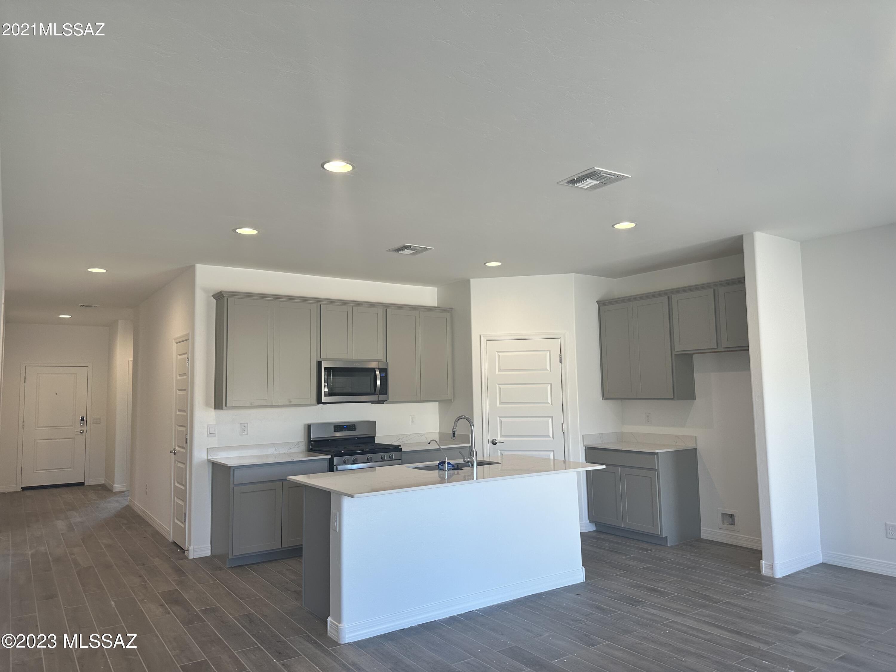 This great home is nestled in the beautiful DR Horton Community of Tortolita Trials in the Tortolita Mountains. The Cali floorplan has a huge great room design. Tiled shower walls at Bath 1. The kitchen features a big island with quartz counters, stainless appliances, water filtration system, and 9' ceilings. 4 Bedrooms and 2 full Bathrooms. 2 Car garage and lots of yard space. Smart Home Technology is built in!Plenty of amenities near by such as the Twin Peaks Outlet Mall, various golf and dining options.