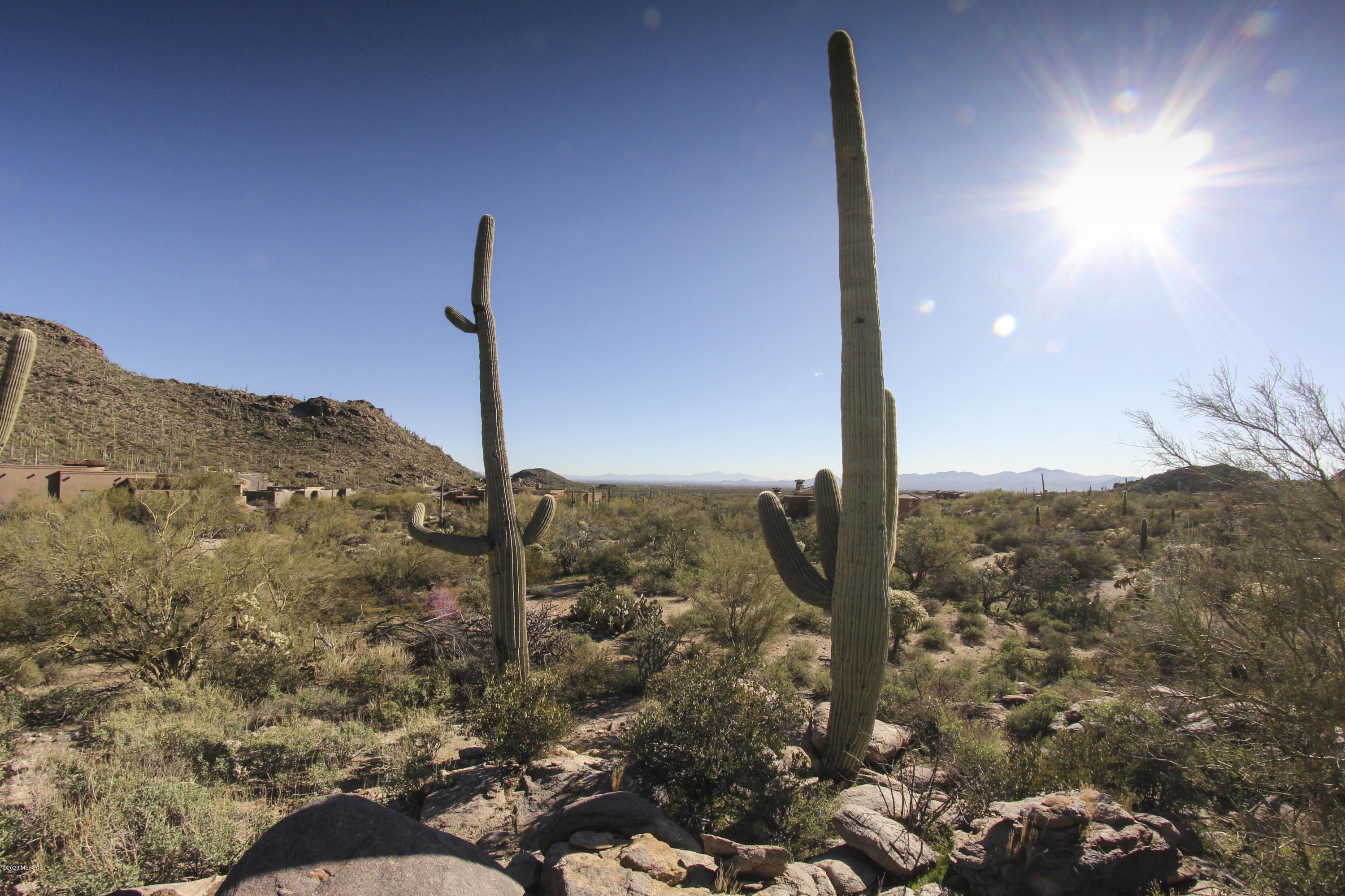 Absolutely stunning setting in the gated community of Canyon Pass at Dove Mountain. This nearly 2 acre lot gives you mountain views, city views, and gorgeous sunsets. Dont MISS OUT!