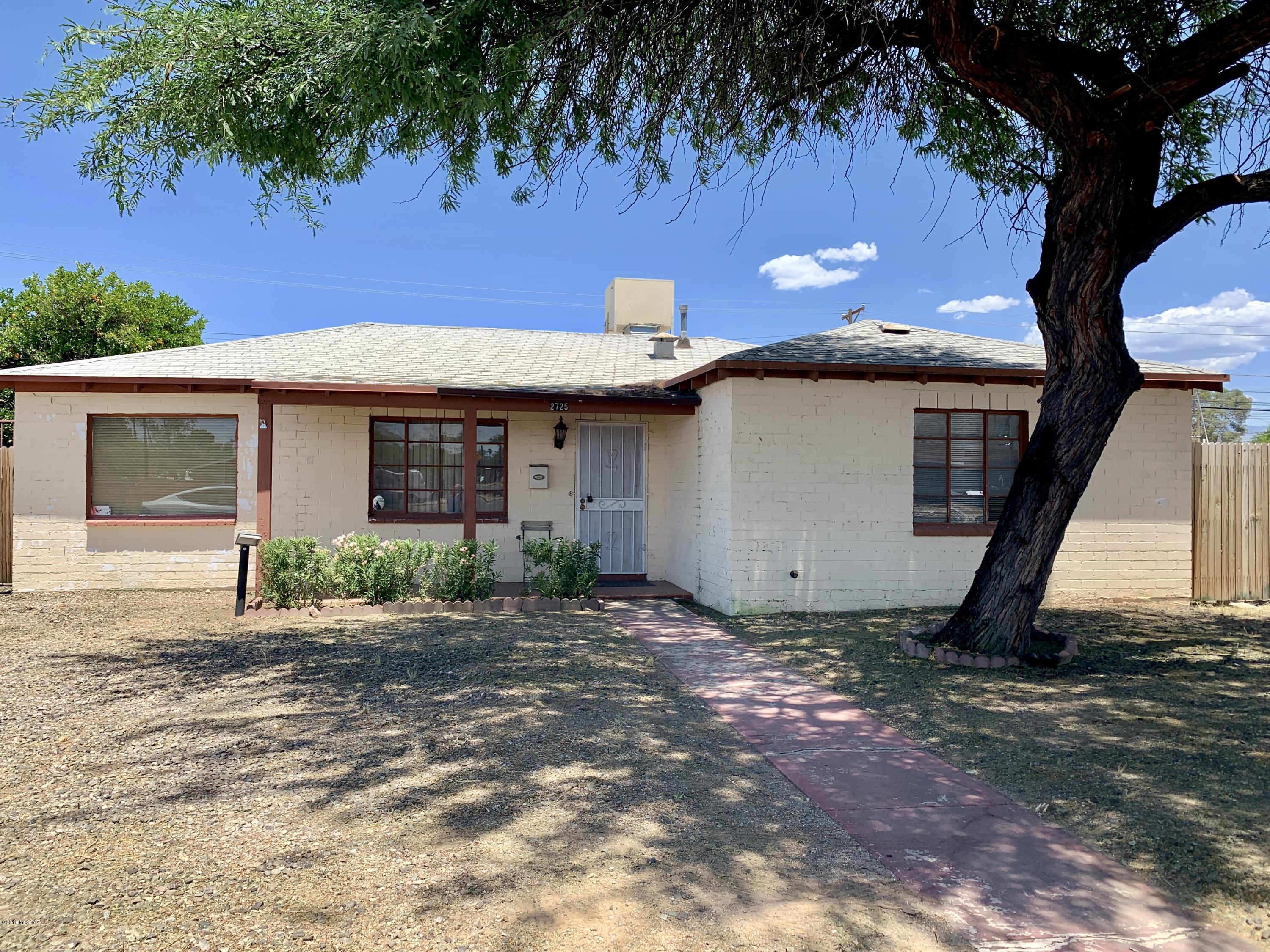 This residential property is zoned C1-Commercial is ready to be restored or updated. It would make an ideal office with parking available around back through the alley.  It was previously ran as a Group Home.  It has a central Tucson location with daily traffic exceeding 25,000 vehicles.  The building features 4 bedrooms/offices, 2 restroom facilities and a full kitchen.  A new electric panel has been installed and is up to code.  This property is ready for a cash buyer to come in and rehab it to its full potential.  The home/office is within walking distance to Reid Park.