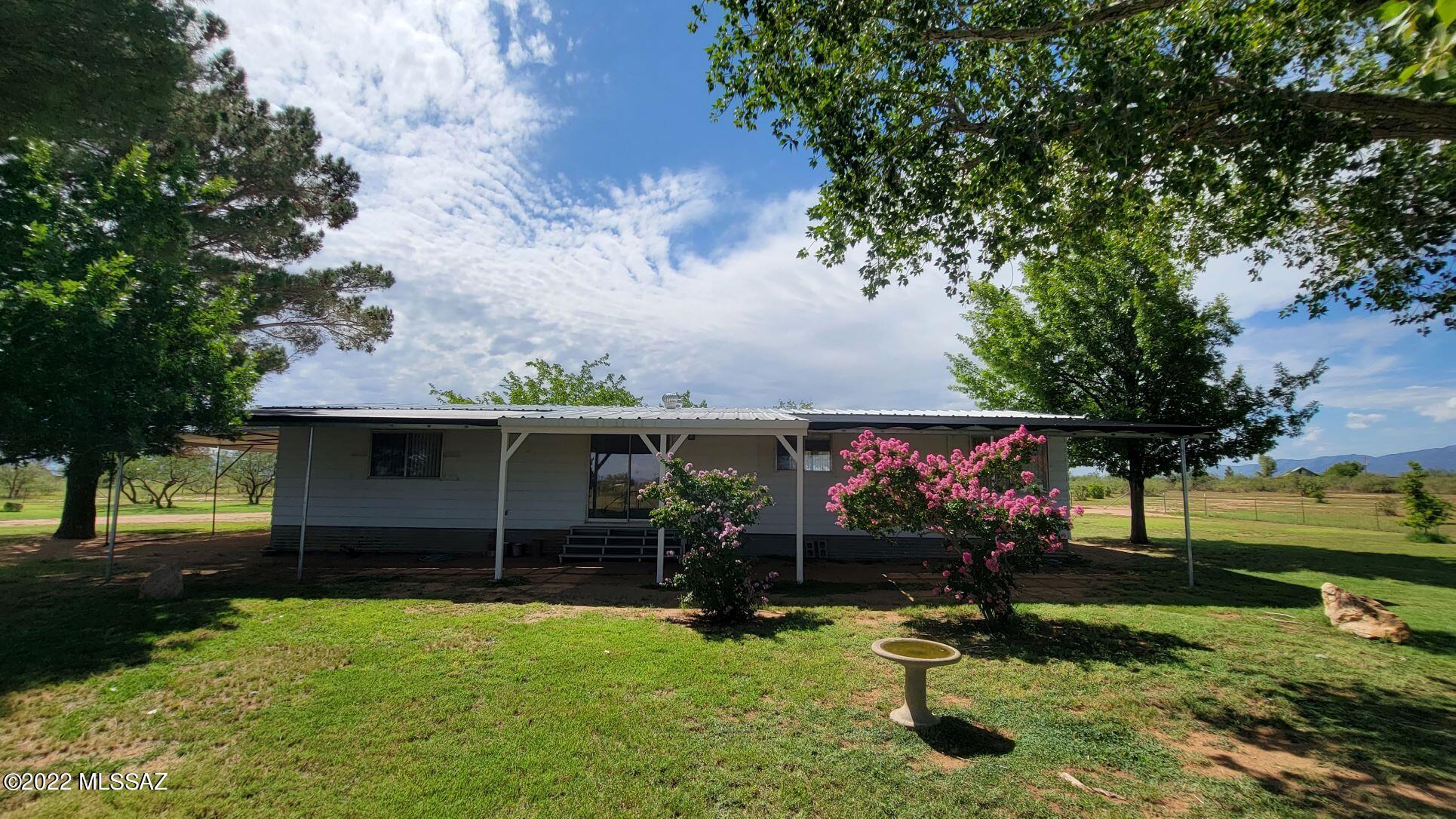 Beautifully maintained and updated country home on five manicured acres. All fenced and cross fenced.. Private well has new pump and has been deepened. This two bedroom, two bath home has a large open floor plan. Newly painted, new kitchen and appliances. Enjoy your mornings in the the AZ room.  Let me show you this home today.