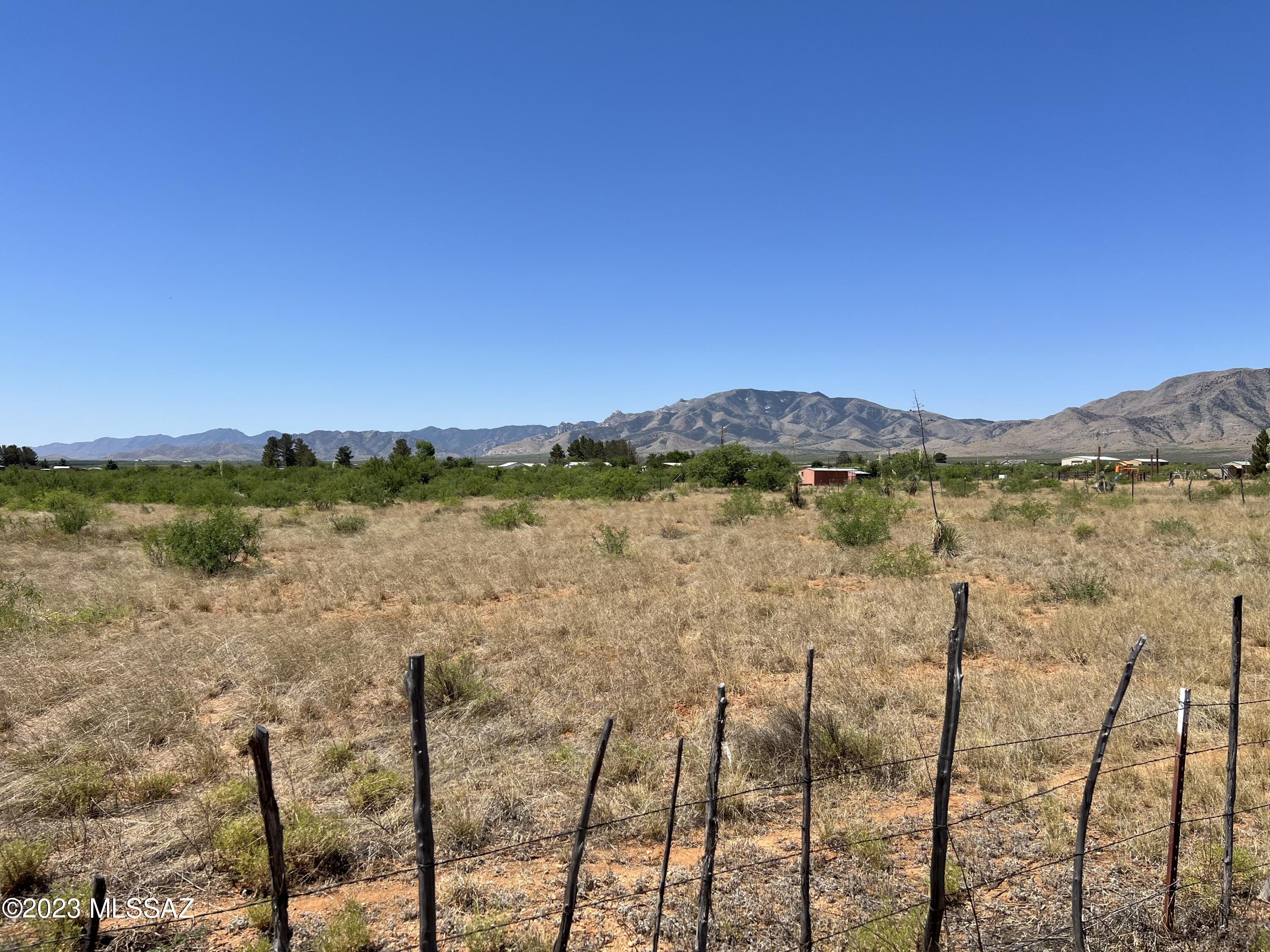 Nice level  4 acre parcel with 1/3 well share. adjacent to Dragoon rd but entrance is off of Evelyn Rd. Great investment property or ready to develop. Come enjoy rural living with open spaces, clean air and the best year round climate southeast Arizona has to offer.