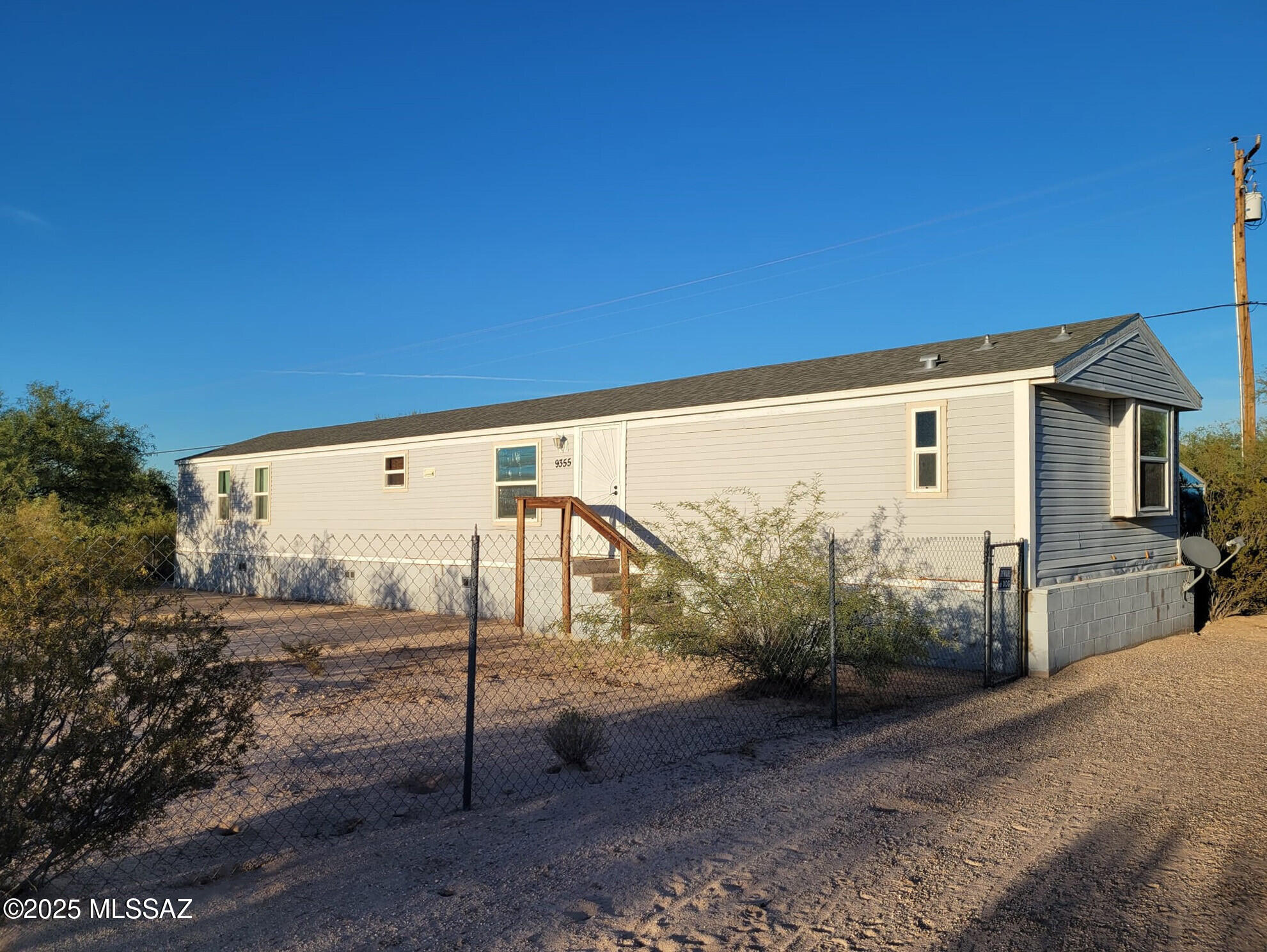 Enjoy starry nights and mountain views from this nearly 2-acre property in the heart of Three Points! Located in a rural community just 30 minutes west of Tucson off Ajo Way. You will have a stunning view of Kitt Peak right from your front door. Multiple hiking and ATV/horse trails are short distance. Altar Valley Middle School is next door, with Robles Elementary School just across the street. This 4-bedroom/2-bath home has all electric appliances. Updates include a new water heater, dishwasher, kitchen butcher-block countertops, and a freshly painted great room/dining area. High-speed internet is available for your home office. The front and backyards are fully fenced. The property has a storage shed, plus plenty of space for an RV, off-road toys, or horses.