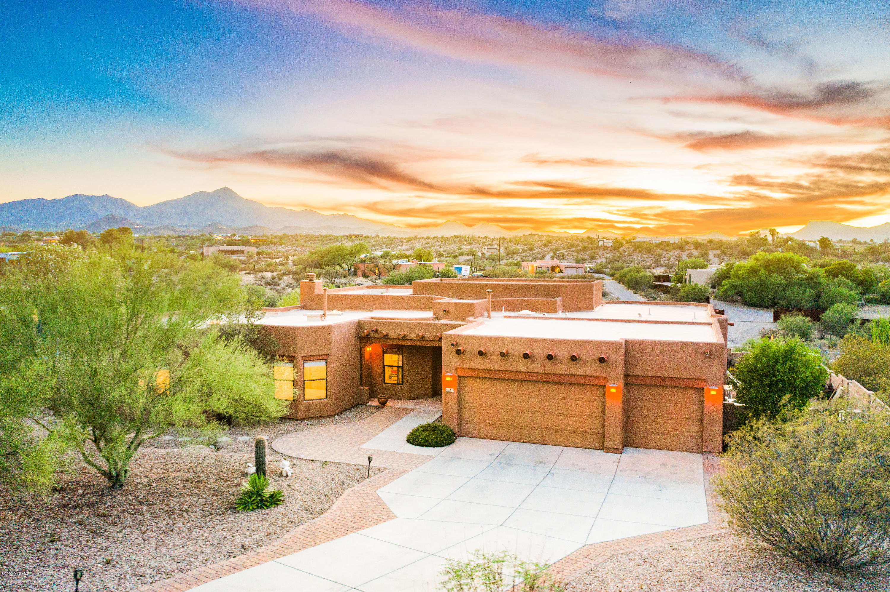 Seller will accept or counter offers between $599,900 and $615,000. BREATHTAKING, Sombra Sante Fe Style Single Story Home with Gorgeous Mountain and Sunset Views!!!!  Nestled on 1.8 Acres of a Corner Lot, this Beautiful Home Offers so Much. As You Enter the Home You are Greeted with Beautiful Exposed Wood Beam Columns and Stunning Mountain Views!  Enjoy the Salt Water Pool, Spa, Outdoor Kiva Fireplace and Double Patio Area for Entertaining and Watching the Sunset Just to Name a Few.  This Home Offers a Split 5 Bedroom Floor Plan with 3 Baths and 3 Car garage at just under 3000 Sq Ft.   The House Boost a Great Room Concept Where the Family Room is off the Kitchen with a Kiva Fireplace and Wet Bar for all Your Entertaining Purposes for Family/Friends and Holiday Gatherings. Come Fall in Love with Everything this Home Truly has to Offer!!