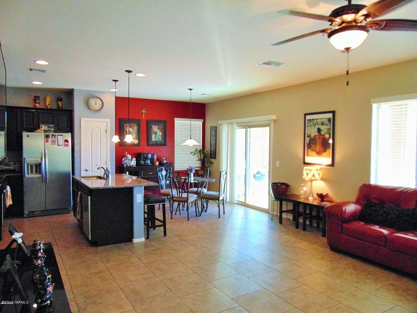 BETTER THAN NEW! Enjoy this beautiful Salsa Model:4bd / 2.5 ba / 3 car garage + den + loft on large lot.  Tons of upgrades: Granite kitchen counters, Espresso kitchen cabinets, SS gas stove, dishwasher, microwave and refrigerator. Ceramic tile throughout first floor and in all bathrooms. Bathrooms with executive  height counters and espresso cabinets. Master bathroom offers deluxe package.  Den can be used as formal dining area. Laundry room upstairs. Water softener and reverse osmosis included.  Ceiling fans in all rooms. Big  backyard with gravel. This property is in move in condition. A MUST SEE! Enjoy the community pool and parks that Madera Highlands offers.
