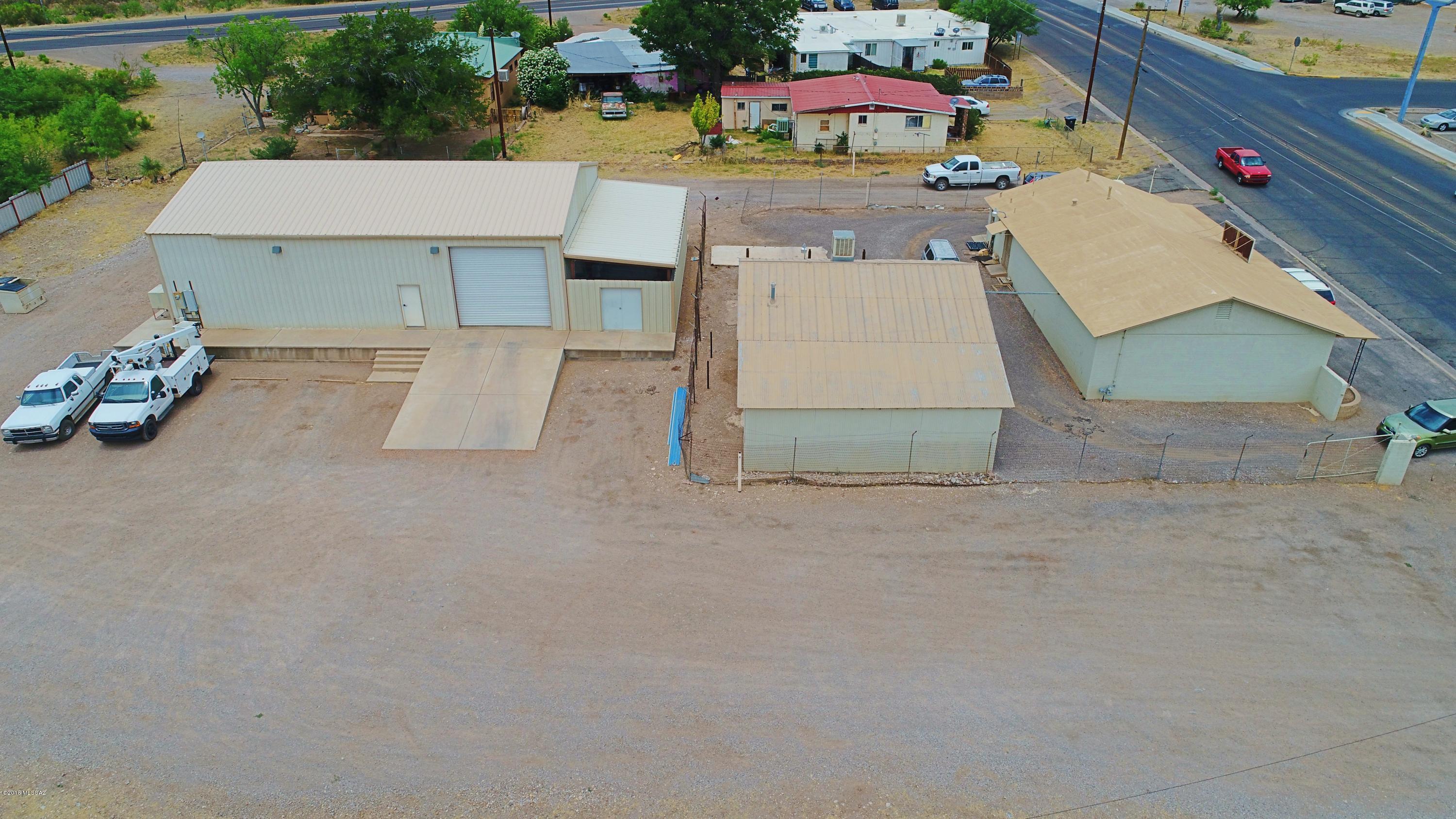 Address is 1116 & 1118 Naco Hwy. Don't pass up on an opportunity like this to own prime commercial property in Bisbee. Located on Hwy 92 and Naco Hwy. There are two parcels included in this sale, vacant land located on Hwy 92 ( parcel # 102-23-004d .84 acres) and the other parcel has the 3 buildings located on it ( parcel # 102-23-004C .78 acres). A total of Approx 1.62 acres. The warehouse is approx. 2433 sq. ft,the warehouse has a private office,mini split heating and cooling system,ramp & dock with drive through doors... in one side, out of the other,3 phase electric and a large outside covered storage area & private bathroom. Click ''More'' The office supply building is approx. 1984 sq. ft. has central heat and air.There is an additional building is approx. 840 sq feet that would be perfect to rent out. A total of 5257 sq ft. All 3 buildings have metal roofs,The office supply inventory and trade fixtures are not included in the sale price. The office supply building was built in 1964, the other buildings were built in 2005. Tax figure is for both parcels (004c $2082 & 004D $1334) . Utility expenses can be found under the DOCUMENTS tab. Seller would consider an owner carry with 150k down. All facts, figures and measurements are approximate and to be verified by the buyer.