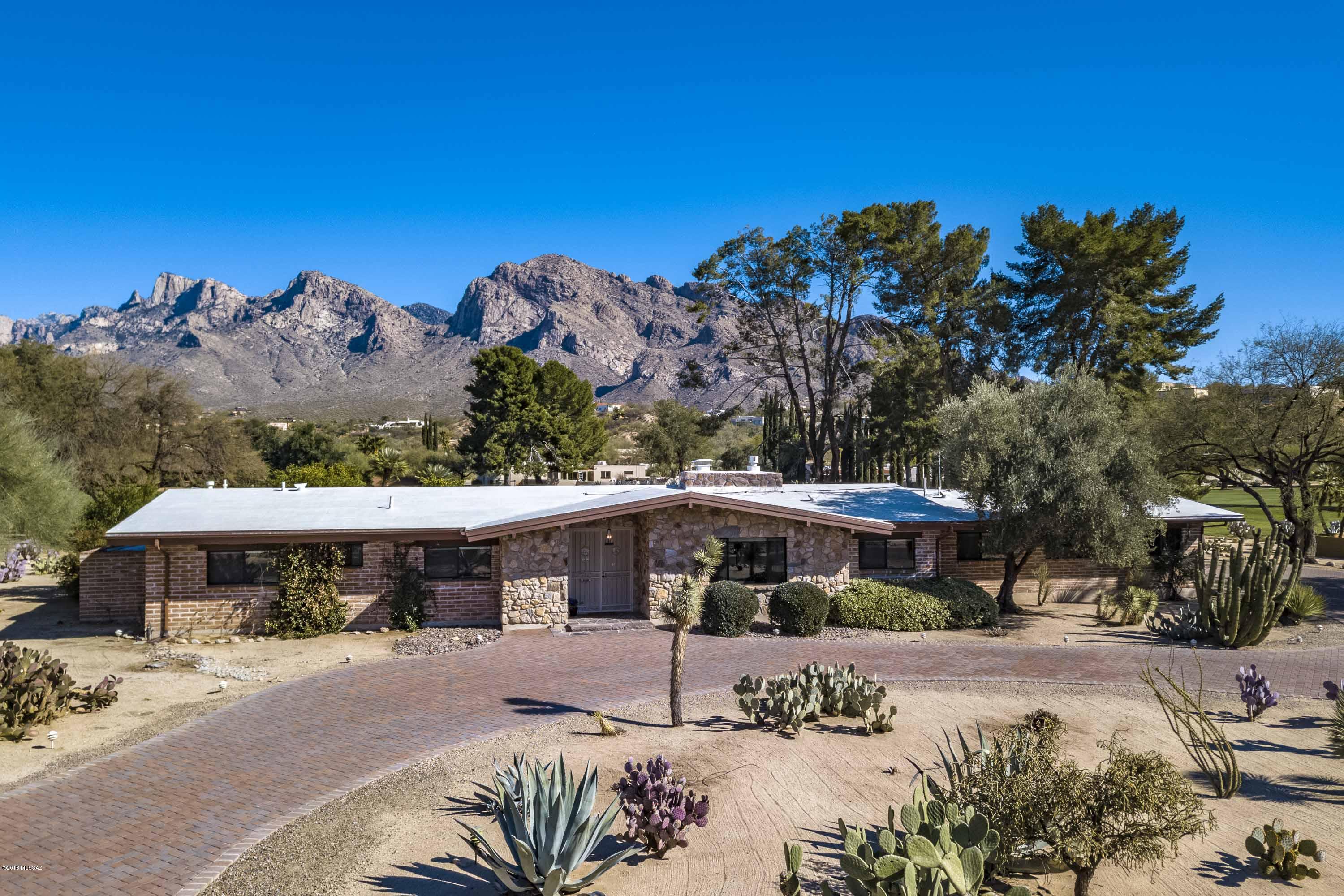 Without a doubt, this home will impress.  It has a special strength and character, which is stunning with impressive upgrades and updates. The location is on a premium lot, and it's Mountain and Golf Course Views are Spectacular.  Looking out onto the 11th fairway, this home hosts a sense of style and grace. There are high vaulted ceilings with beautiful wooden beams.  3032 sq.ft, with 3 bedrooms and 3 newly remodeled full baths.  The kitchen has been updated with Stainless Steel Appliances, New Cabinets, Quartz Counter tops and a large Granite Counter-top island. The East side of the home has large windows and a sliding glass door that brings the beautiful outside in.  There's a striking field-stone wall between the great-room and the kitchen adding warmth and elegance to this home. The Greatroom has a gas fireplace as well as the kitchen, and there's an adjoining large Den, which can be used as an office, exercise room, or whatever you want.  The West facing front circular driveway and the East facing back patio have been redone with all new pavers. The pool and the spa are able to be heated. Please read All Feature's list under Doc. tab in the MLS. All personal furnishings are available, in a separate B.of S. This is a very special home!   It is " Move in ready". Don't Miss.