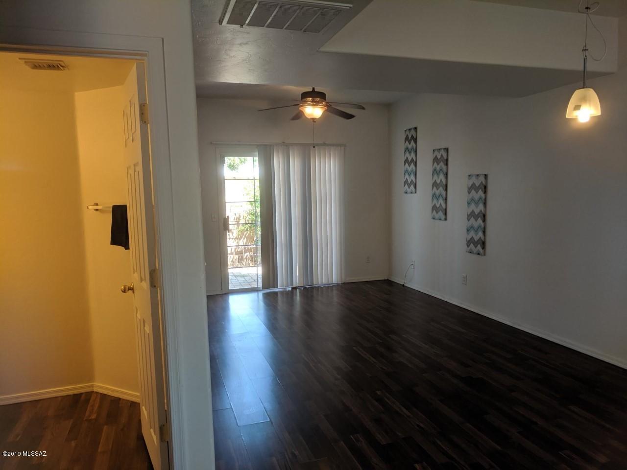 Contemporary Central Townhome. Perfectly located- Bike to the UA or be downtown in 10 minutes. This 15-home community is small and perfectly situated right next to Blenmann Elmentary.  Historical Neighborhood. 3 bedroom, 2.5 bath, a one car garage, and has a family room, dining area, mountain view, and overly spacious bedrooms with huge closets and one has a balcony. Entire first floor has gorgeous laminate wood flooring and a great room-concept-open and bright and easy to care for. Plenty of room in the backyard for BBQ, lounge chairs, private storage room, and more! A true rare find.