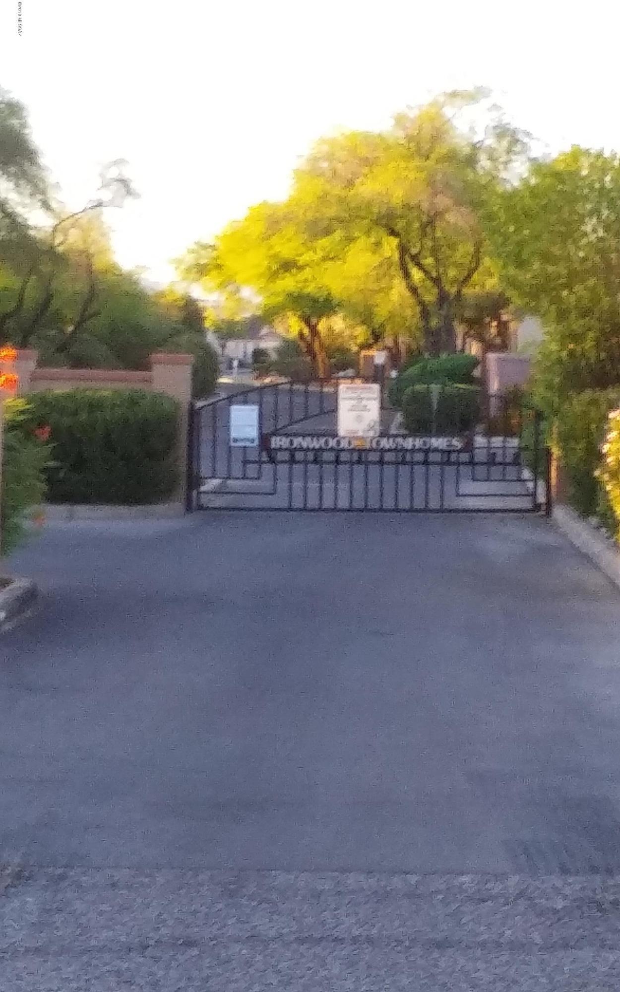 This three bedroom, two bath, two story townhome in a gated community is waiting for you. Master bedroom downstairs and two bedrooms upstairs. Close to schools, shopping, restaurants, medical and within five miles of University of Arizona. Storage off of garage. Garage is open to entryway of unit. Community pool and spa. HOA includes water, sewer, street and parking maintenance, pool, grounds and common area.