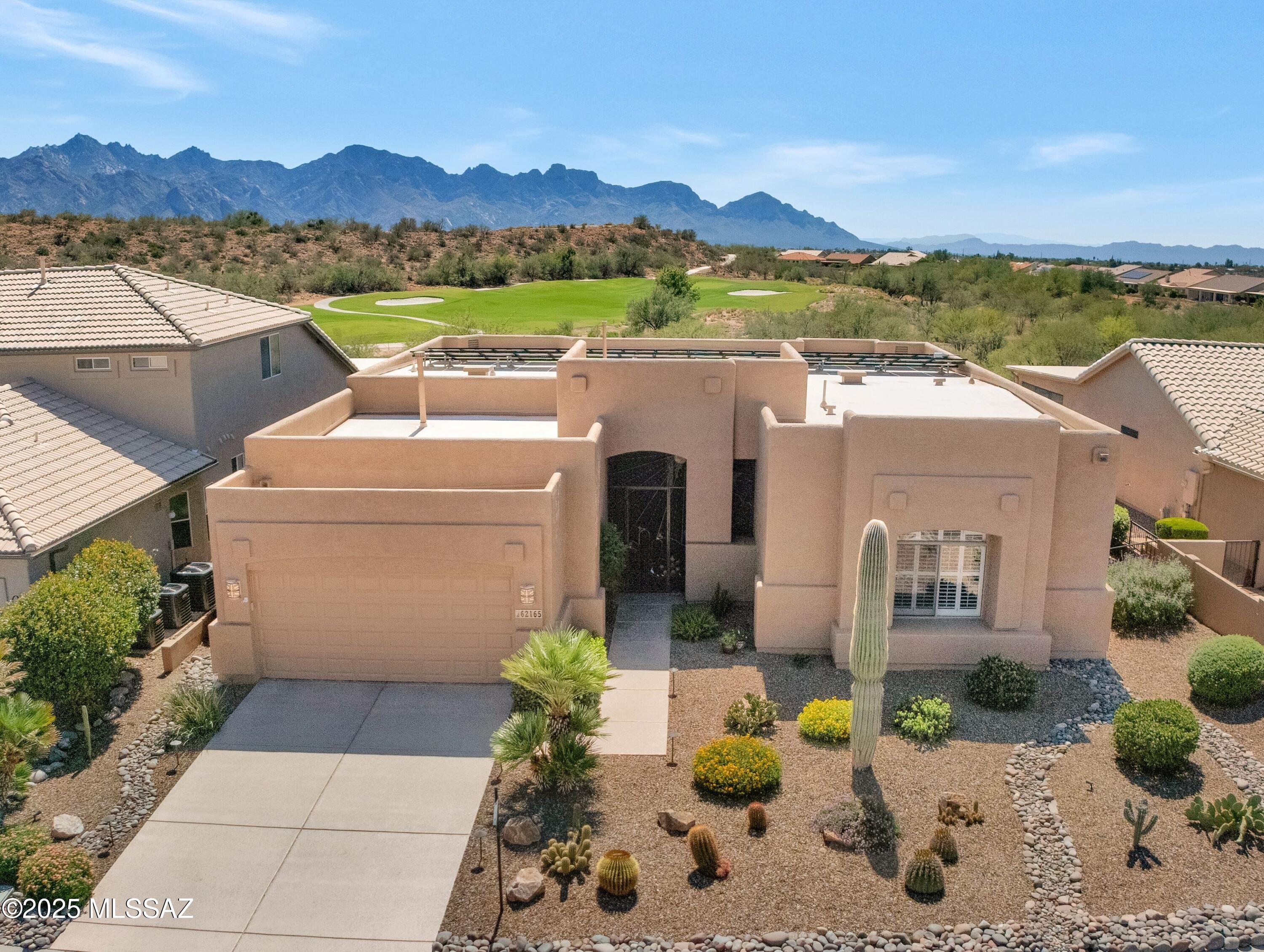 Updated Santa Fe Dakota Located on Quiet Cul-de-sac street with Solar, Golf Course & Mountain Views. Spacious Great Room with Dining Area/Flex Area. Kitchen has Granite Counters, Stainless Steel Appliances, Cabinets, Island, & Desk. Family Room with Gas Fireplace & Slider to Patio. Owner's Suite has Slider to Patio & Ensuite with Dual Vanity, Custom Walk-in Shower & 2 Closets. 2 Guest Bedrooms with Closets, 1 Bedroom has built-in Bookcase for Office/Den. Guest Bathroom near by. Laundry Room has W/D & Cabinets. 2019 Exterior Painted & 2023 Irrigation Replaced. Extended 2 Car Garage with 2022 HVAC, 2018 W/H, Utility Sink, Cabinets & Epoxy Coating. Screened & Covered Patio with extended Pergola with Hot Tub, Built-in BBQ, Kiva Fireplace,  Fruit Trees, Garden, Gated Yard & Mountain Views