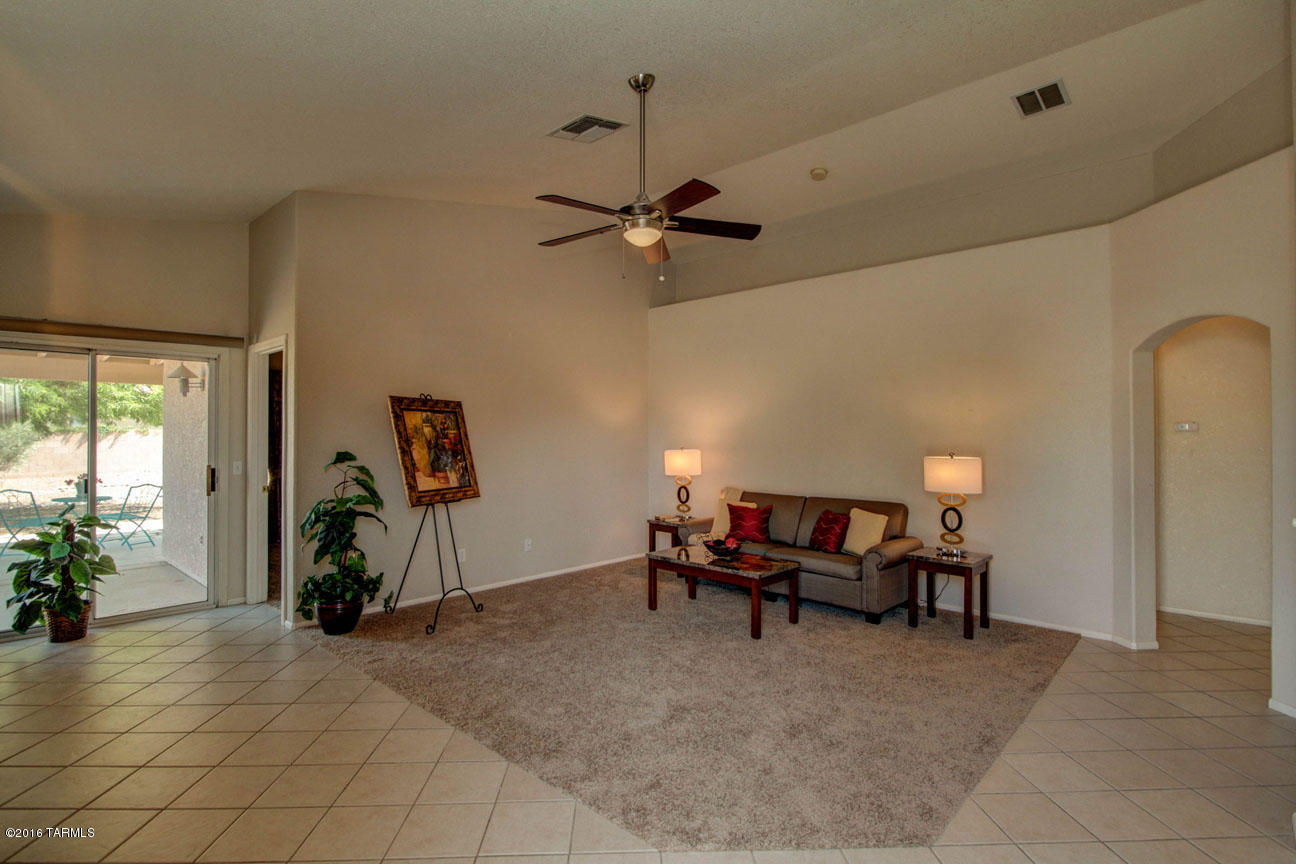 Model perfect & move in ready!  Gorgeous 3 bdr home with tile flooring, new carpet, vaulted ceilings, large open great room, dining area, bright/sunny front eat in kitchen, split bedroom plan, ceiling fans, custom lighting, all appliances, plantation shutters, newer paint, 2 walk in closets, spacious master suite, extra lrge master bath shower & dual sinks, pool sized corner lot (over 7500 sf!), extended covered patio, bkyd view of Sombrero Peak, situated near community pools/spa, ball fields, bike lanes, schools, hiking trails, golf course, shopping, restaurants, river walk, skate park, community tennis courts & easy access to I-10!
