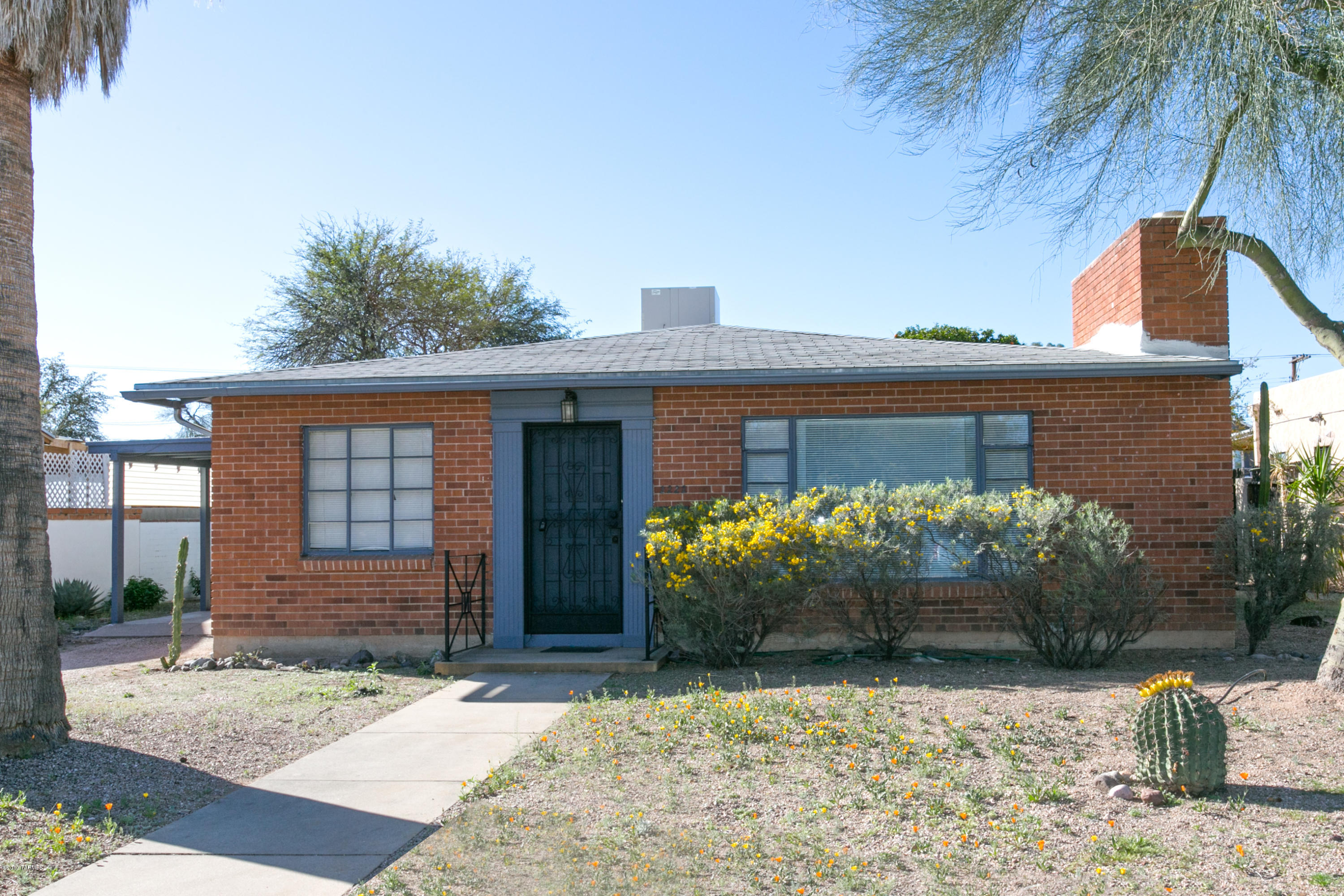 Charming Mid-Century Brick home with guest house nestled on one of the best streets in the desirable historical neighborhood of Blenman. 5 blocks to UA and the street car stop. Main House 1235 sq ft has 2BR/1BA, spacious beautiful living room w fp and large picture window framing the Catalina Mountains. Kitchen has eat in area and side door entry to carport. Both bedrooms are spacious w built ins and plenty of storage. Large backyard w beautiful mature vegetation, covered patio and ramada. Guest house, 544 sq ft, features large living/kitchen area, 3/4 bath and large bedroom w porcelain tile throughout. This is a great opportunity to live close to the University/downtown in main house and rent the guest house.