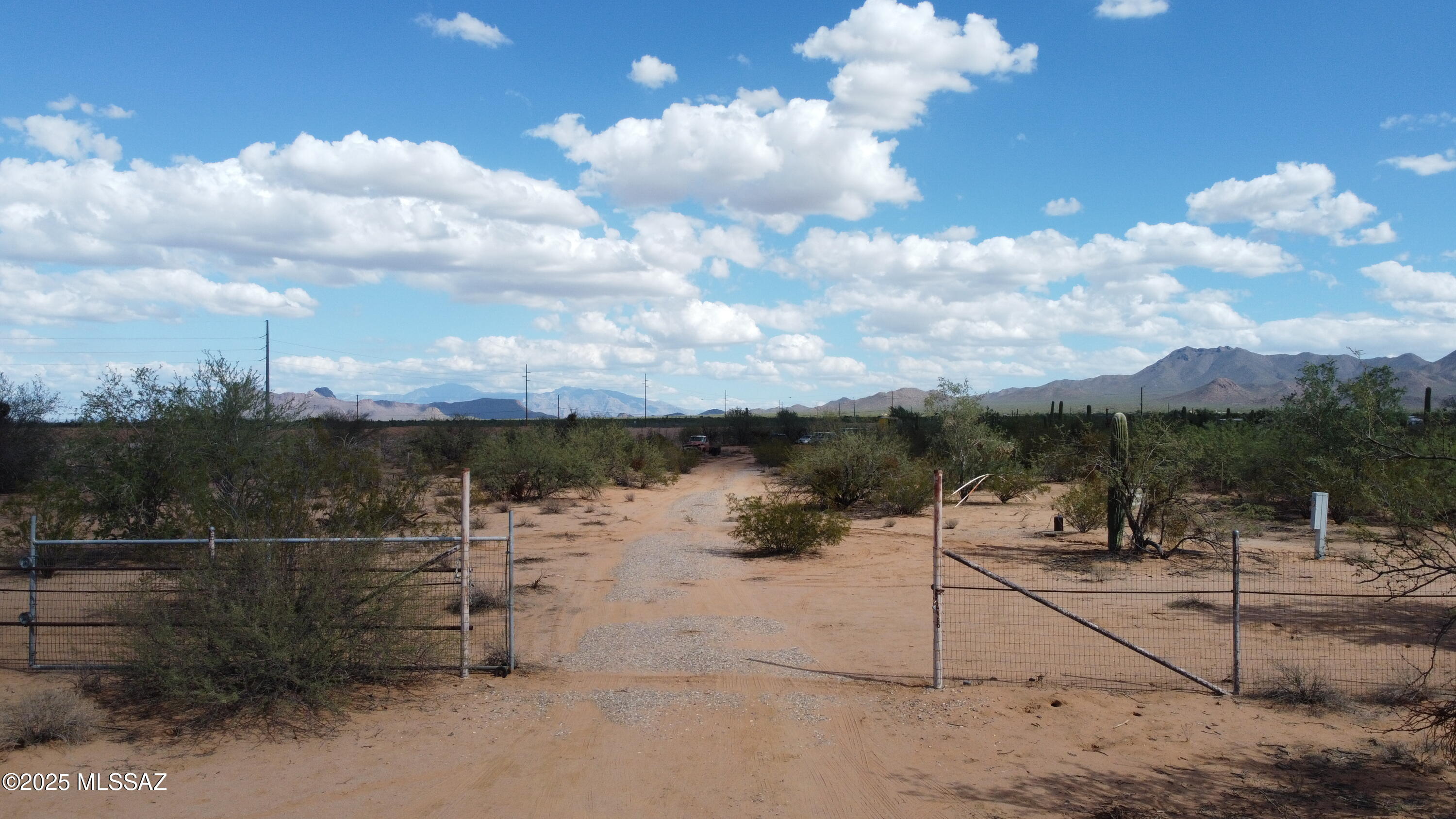 Experience peaceful desert living on this stunning 2.29-acre lot with panoramic mountain views. The property features an existing well, electrical pedestal, and an 8-foot chain-link fence along the north side boarding the CAP canal for added privacy. Enjoy breathtaking sunrises and sunsets with Red Rock Mountain views. Located on Tucson's west side, this is the ideal setting to build your dream home and enjoy the serenity of Arizona living.