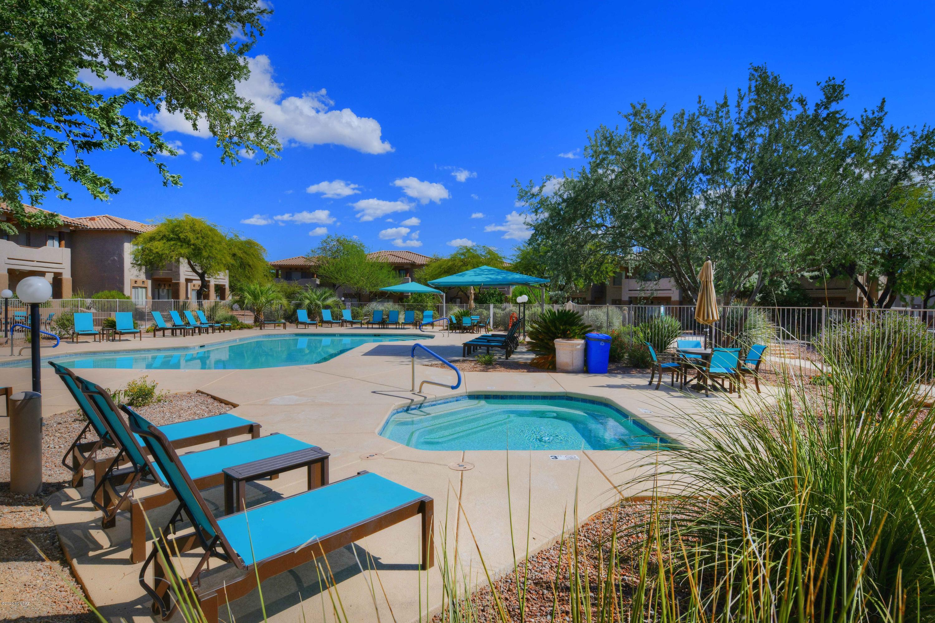 Desirable Vistoso Resort Casita 1st floor unit sold TURN-KEY with all the furnishings and accessories. Great Room design with 3 separate rooms perfect for having a guest and den/office space. Open floor plan includes, built-in entertainment center, breakfast bar, dining area and laundry room. Sit on your covered patio and enjoy the beautiful sunset and mountain views, sun up or sun down! Enjoy leisure time golfing at the beautiful Views Golf Course only 5 minutes away or stay on site and lounge at the community pool and jacuzzi or use the clubhouse fitness room. HOA fees include basic cable, WIFI, water, sewer, garbage, building insurance, building exterior (yes painting and roof) maintenance and landscaping. Leave the worry behind and enjoy the comfort of condo living!