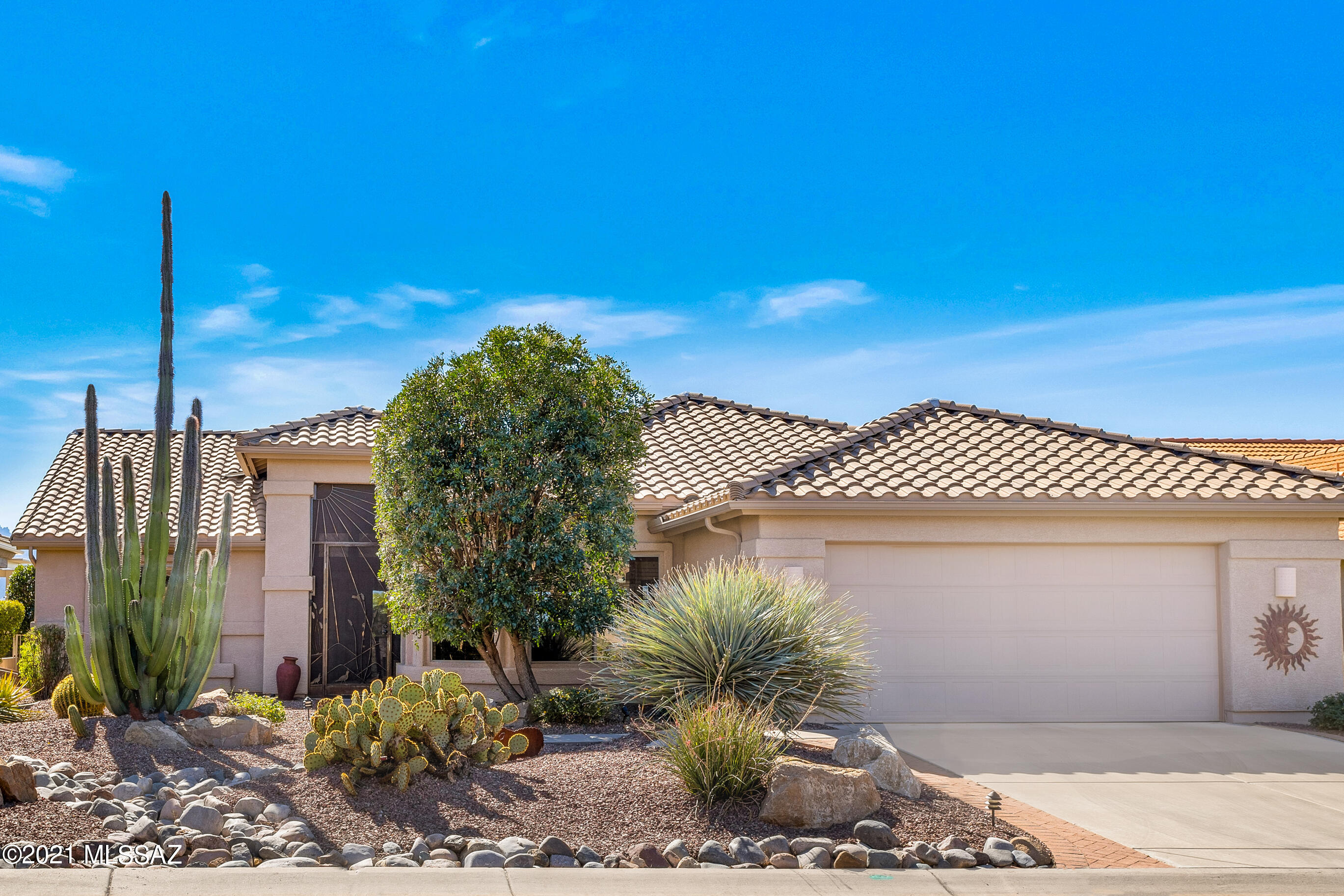 We're Proud to Present an Extended Laredo with Panoramic Mountain Views.  This 2 Bedroom + Den / 2 Bathroom / 2,068 SF / 2 Car Garage Home is just what you've been waiting for!  Custom designed front entry door. Open Concept living. Great Room with gas fireplace has walls of windows & large slider to patio. Kitchen has Granite countertops, abundance of cabinets & kitchen dining area. Owner's Suite with bay window & mountain views. Owner's bathroom with walk-in shower & walk-in closet. Den/Office with accordion door for privacy. Guest Bedroom with bay window & mountain views.  Guest Bathroom. Garage with utility sink. Covered Patio with extended paver patio. BBQ station. Fire pit to relax & enjoy life. Lovely landscaping & yard. Welcome home!
