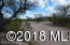 UNDERGROUND POWER and WATER ON LOT!  Meter box already on the lot.  Lovely parcel nestled below a nice mesita for a wind break.  Mature mesquites provide shade and privacy.  Nice alluvial soil for septic and construction of a home.  Modular and alternative okay.  No Manufactured homes.  Less than 10 miles to restaurants, Super Walmart but very private with stirring views of the Tanque Verde, Dragoon and Whetstone Mountain Ranges. Well 
recently maintained and fully operational.  The road gravel-dirt road was well considered and  well maintained.  Well share agreement.