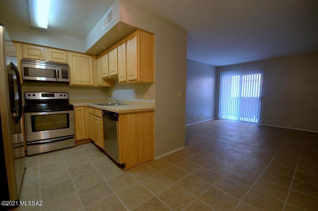 Owner is licensed AZ real estate agent. Convenient location only 2 miles from UofA campus, less than 1 block to bus-line & close to Mountain Ave bike path and Campbell Ave shops, restaurants & more! Spacious 1st story condo has eat-in galley-kitchen w/loads of nice oak cabs, easy-care ceramic flooring in living areas & carpet & walk-in closet in bdrm. Private patio w/storage closet; 1 reserved covered parking space. 
Gated Casa Club Condos has a great location and tons of amenities.
There are 2 pools & spas, sand volleyball courts, new tennis court, racquetball, redwood sauna, fitness center, clubhouse w/big screen tv & billiards, 2 on-site laundry-rooms.
The pics are from a few years go. However, very little has changed since then.