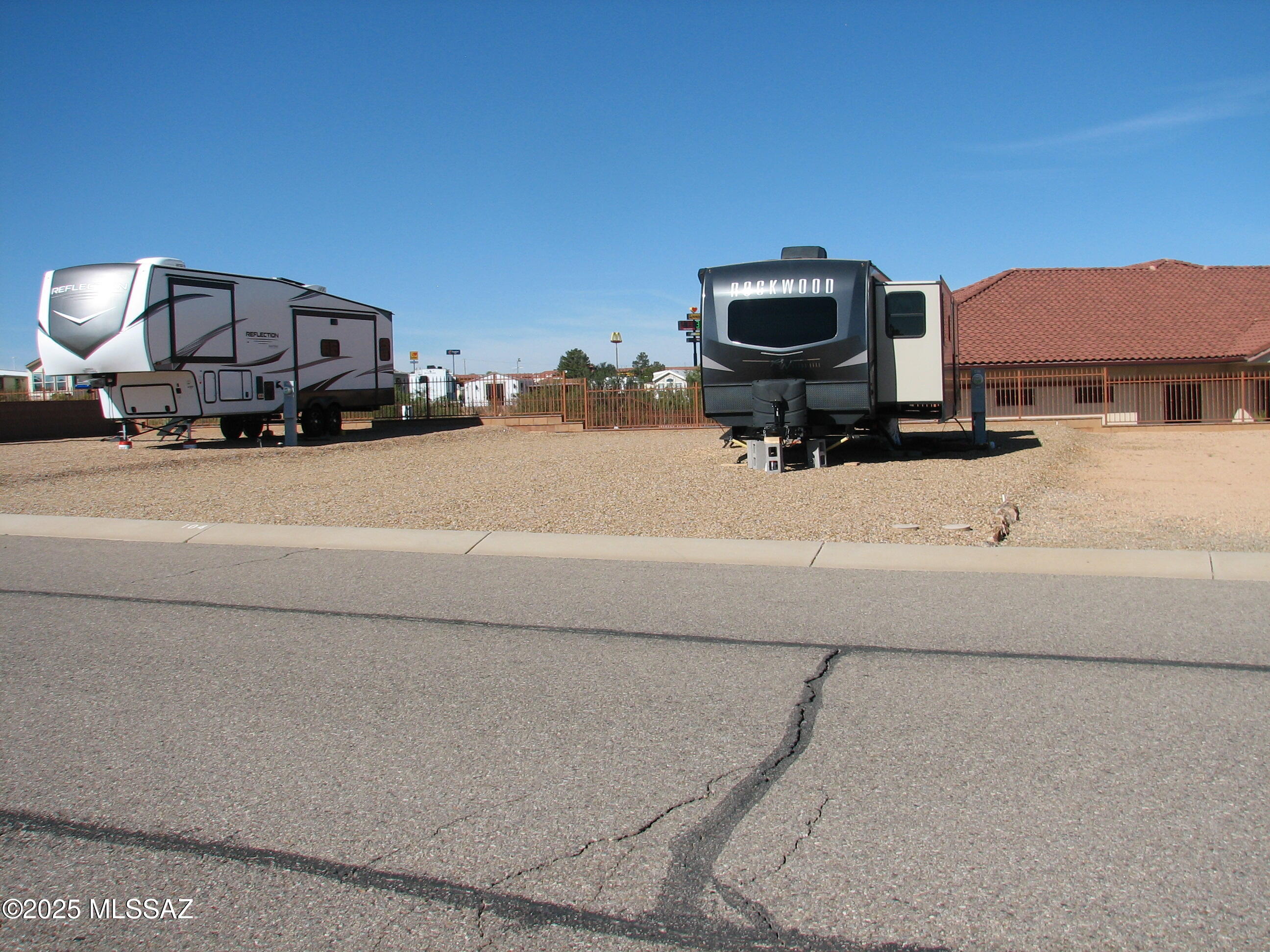 Move on ready lot in pristine Legends RV Resort.  High view lot, just steps away from the Club House which offers pool, laundry facilities, reading rooms, meeting rooms, showers, dining areas and exercise room !   Lot has all utilities on-site and is fully graveled and ready for your home !