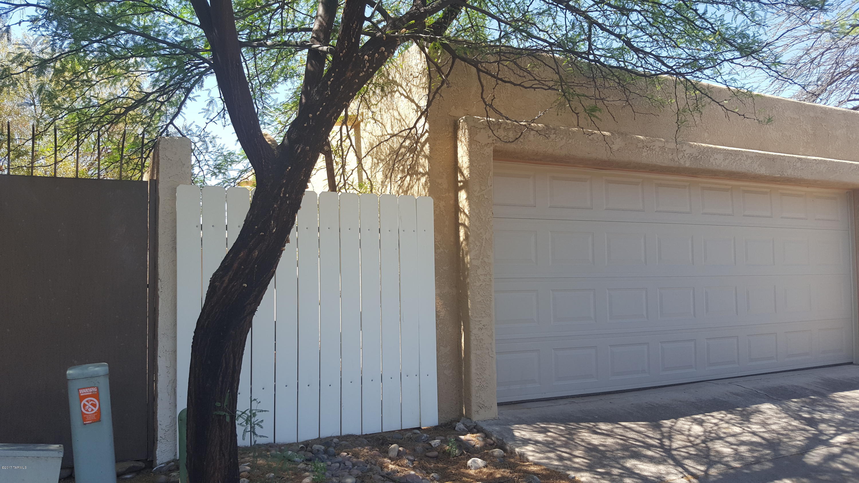 ARE YOU LOOKING FOR A FIXER UPPER? THIS HOME HAS A TON OF POTENTIAL- THIS IS THE PERFECT OPPORTUNITY TO OWN A TOWNHOME IN MENLO PARK FOR A VERY REASONABLE PRICE. HOME IS BEING SOLD AS IS. 2 BEDROOM, 2 BATH, LARGE LIVING ROOM AREA, SPLIT BEDROOMS, A/C, PRIVATE YARD WITH INGROUND FIBERGLASS POOL, 2 CAR GARAGE, NEAR I-10, HOSPITALS, DOWNTOWN, PIMA COMMUNITY COLLEGE, UNIVERSITY OF ARIZONA, SHOPPING, BUSLINES, HIKING AND MANY AMENITES. NO HOA.