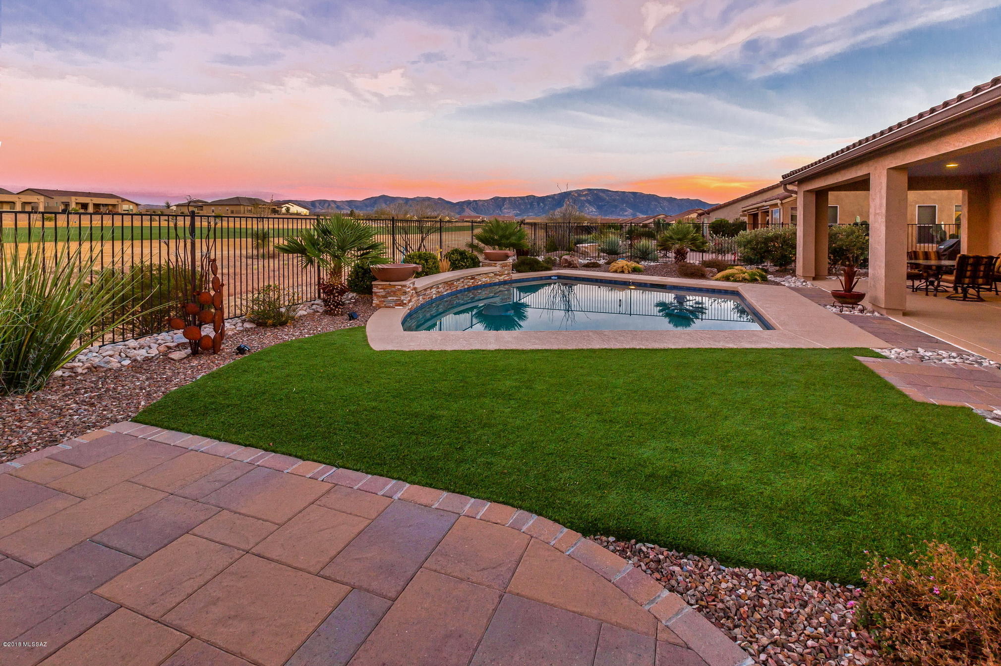 This Popular Mirasol Model sits on a Northeast rear facing PREMIUM GOLF LOT with a Stunning Salt Water Pool & Spectacular Mountain Views. All this makes the focal point of this home its outdoor living space. Imagine yourself relaxing on the patio after a cool swim, enjoying the scenery of your well appointed landscaping, the lush green grass of the golf course and the many colors of the Catalina Mountains during yet another spectacular sunset. This home boast over 132K in upgrades. Some of the many features are * Custom Entry Gate * Private Courtyard * 22''x22'' Tiled Flooring * GE Profile App. * Granite Counters * Tiled Backsplash * Beech Cabinets w/ Crown Molding * Plantation Shutters * Full Laundry Cabinets * 5' Driveway Ext. * 4' Garage Ext. w/Garage Cabinets and workbench * A MUST SEE