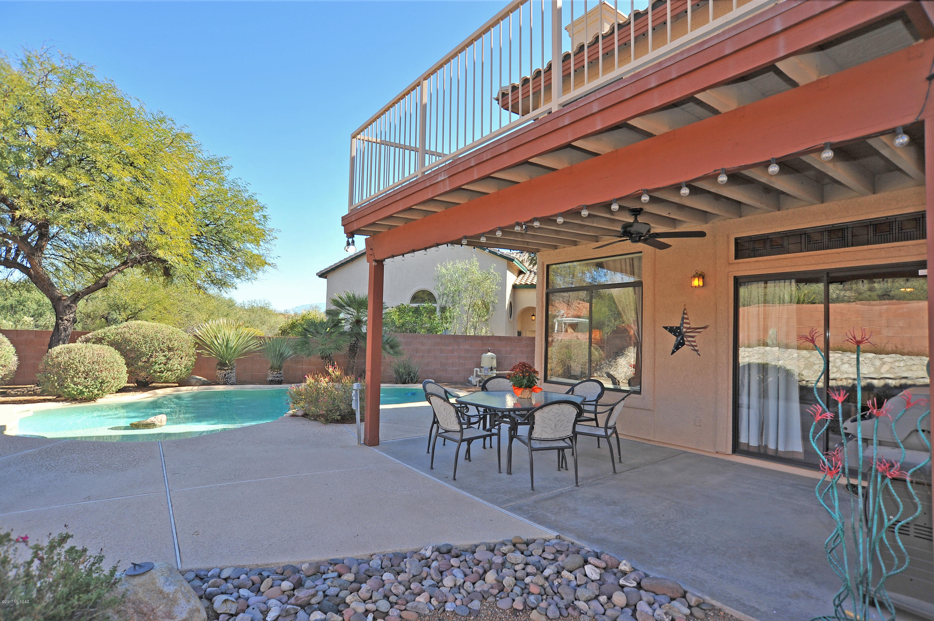 Beautiful Remodeled 2540 sq.ft. 4 BR/3 BA home located on a cul-de-sac with amazing views of the   
Catalina Mountains and Sabino Canyon. Enter into the   Formal Living and Dining Room with vaulted ceilings, 
columns, and curved staircase that leads upstairs to 
Master Suite, two bedrooms, and full bath with skylight and dual sinks. Master Suite has spectacular mountain views from corner windows and balcony. Remodeled luxurious master bath has dual sinks, quartz countertops, walk in closet, garden tub and walk in shower. Sunny and Spacious remodeled gourmet kitchen has double island, shaker style cabinets, 5-burner gas cooktop, quartz 
countertops, breakfast bar and nook w/bay windows. Kitchen opens to the Family Room with fireplace and 
entertainment center. Downstairs has guest bedroom with full bath, and laundry room with utility sink. Step outside to the covered patio and enjoy the relaxing view of the sparkling pool with lagoon.